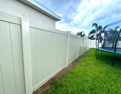 Vinyl Fence Installation using Tan Vinyl Privacy Fence