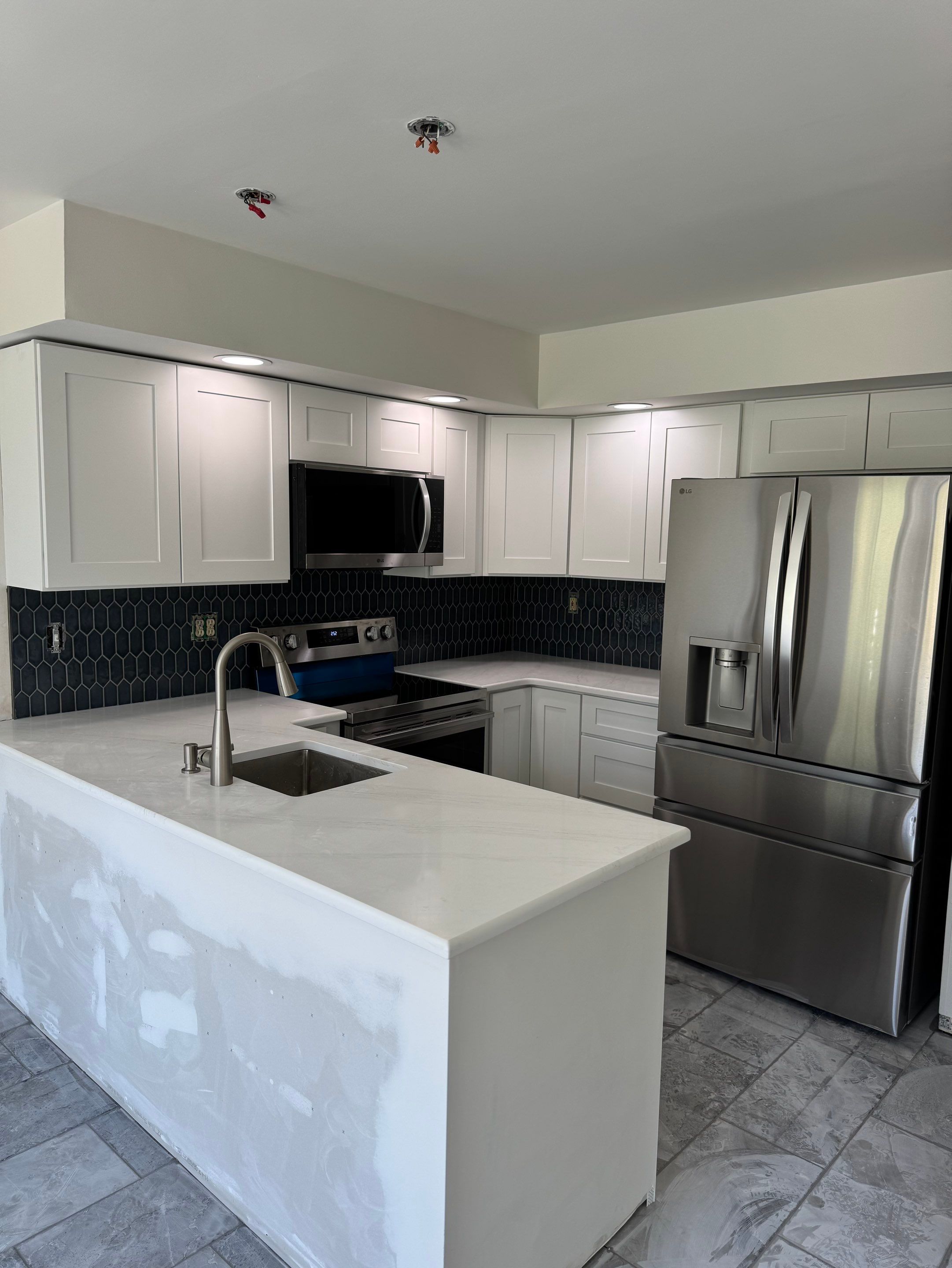 Kitchen, renovation, tile work, flooring, plumbing, painting, trim work by AXR Inc