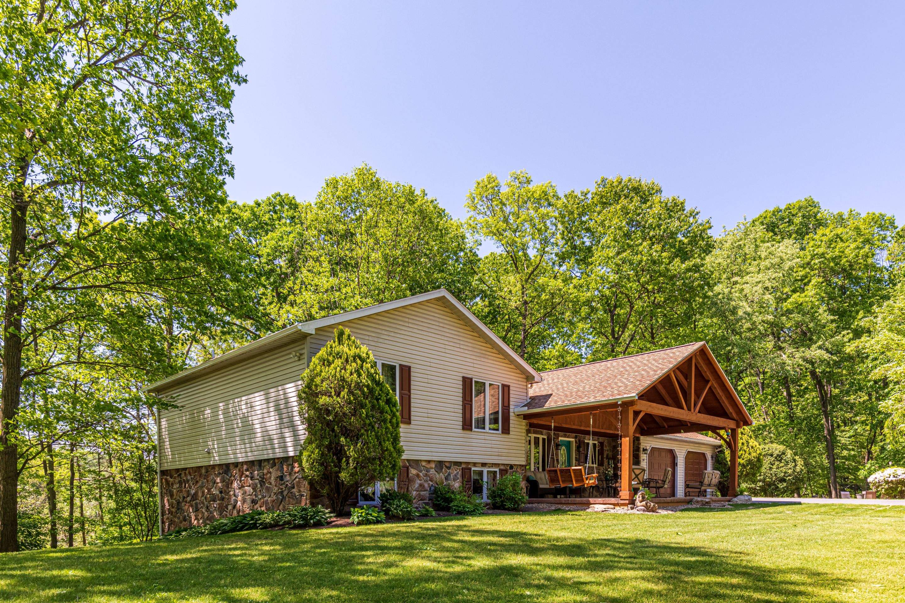 Reshingle-shakewood and timberframe patio roof by Esh Builders