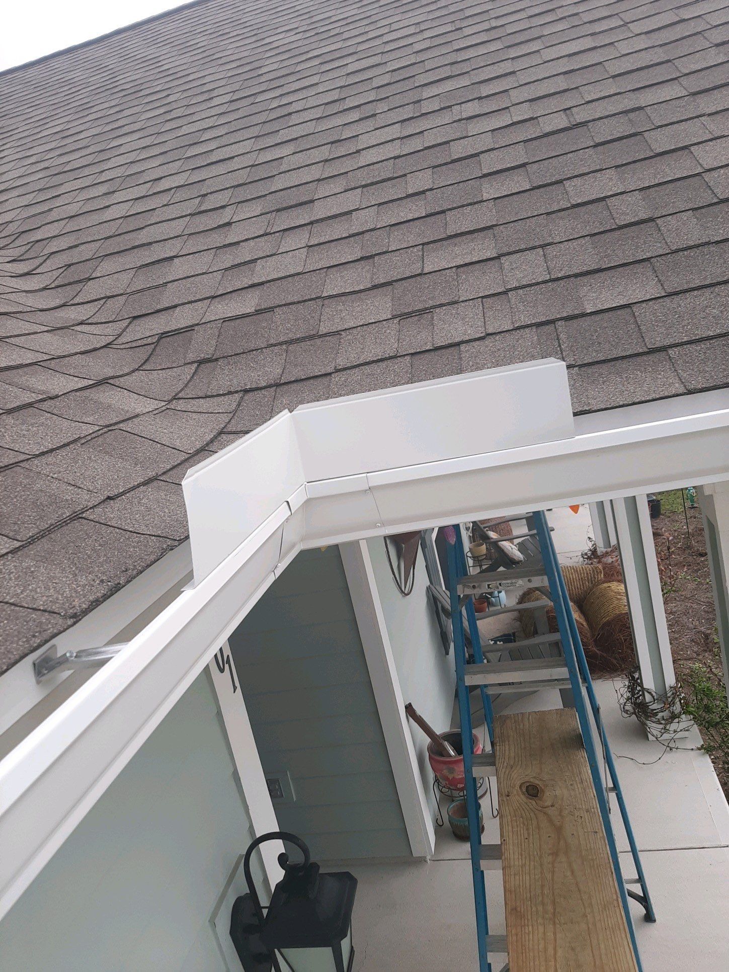 Gutter Installation Using White K-Style Seamless Gutters by Gutter Professors