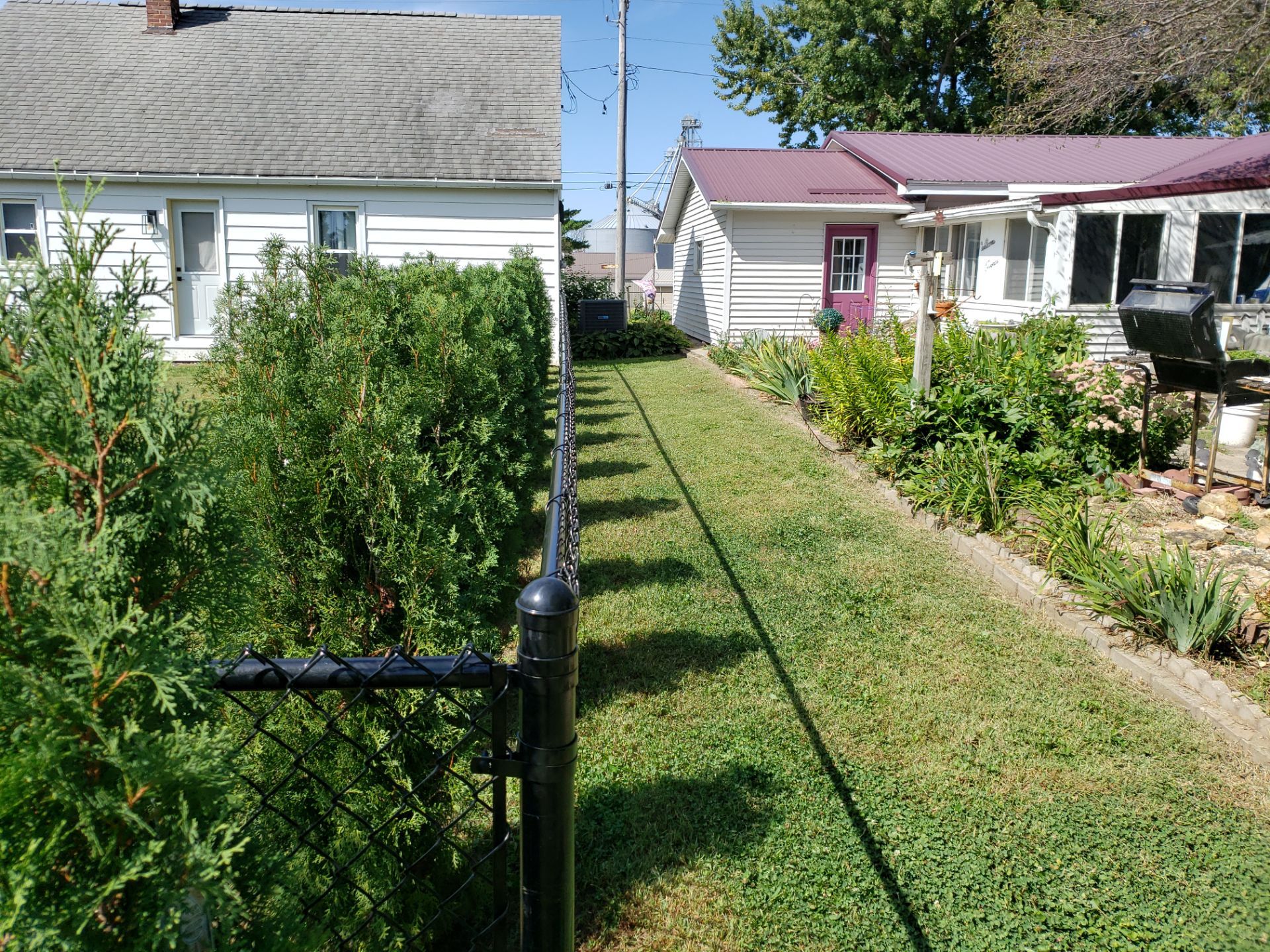Residential Black Chain Link Fencing Project in Wellburg, Iowa by Perfect Picket Fence and Stain