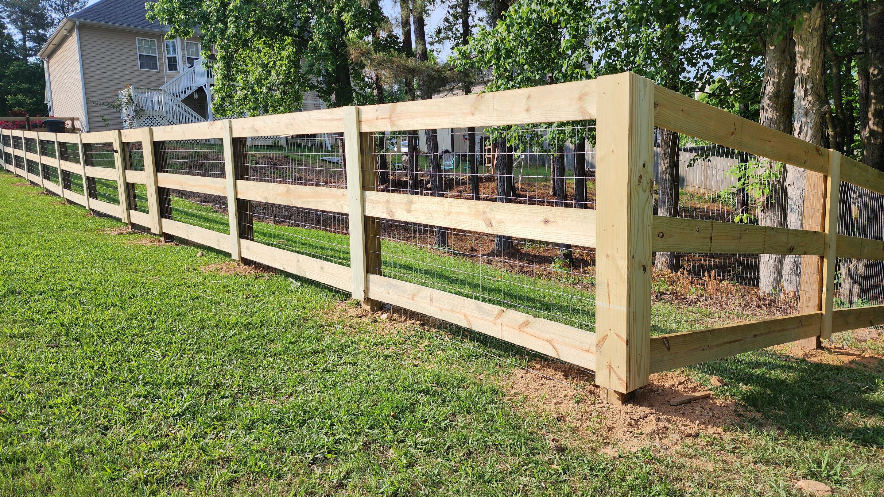 Fence Installation of 3 Rail Ranch with Wire Backing by Titans of Timber Fence & Stain