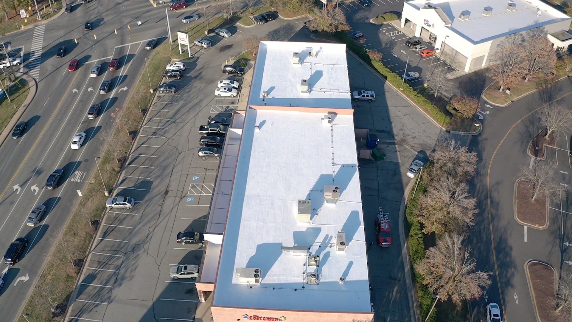 Commercial Coating using Poly Urerthane and Silicone Coating by Just In Time Roofing and Restoration