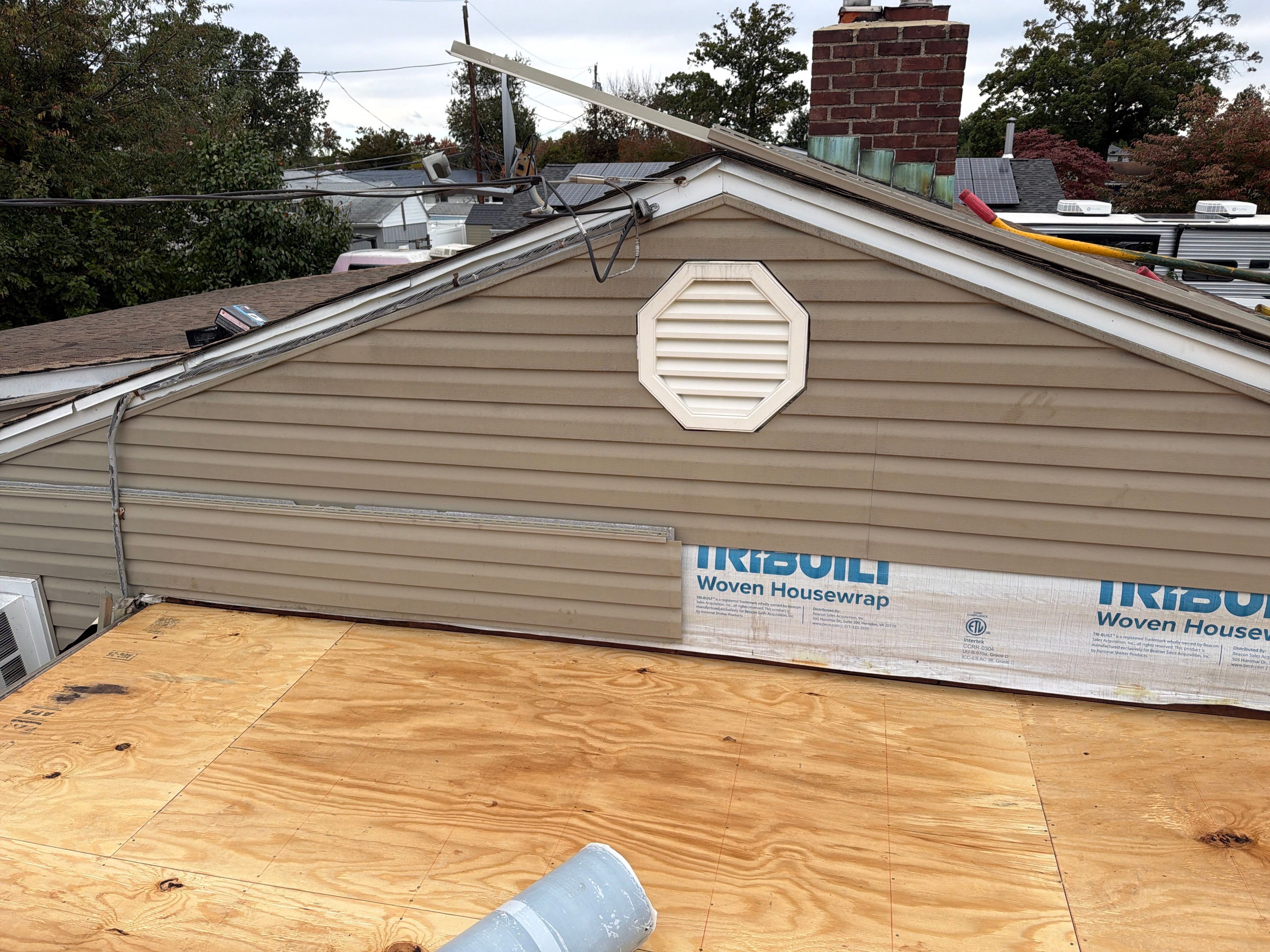 Flat Roof Replacement and Shingle Integration in Levittown by Stofan Construction LLC