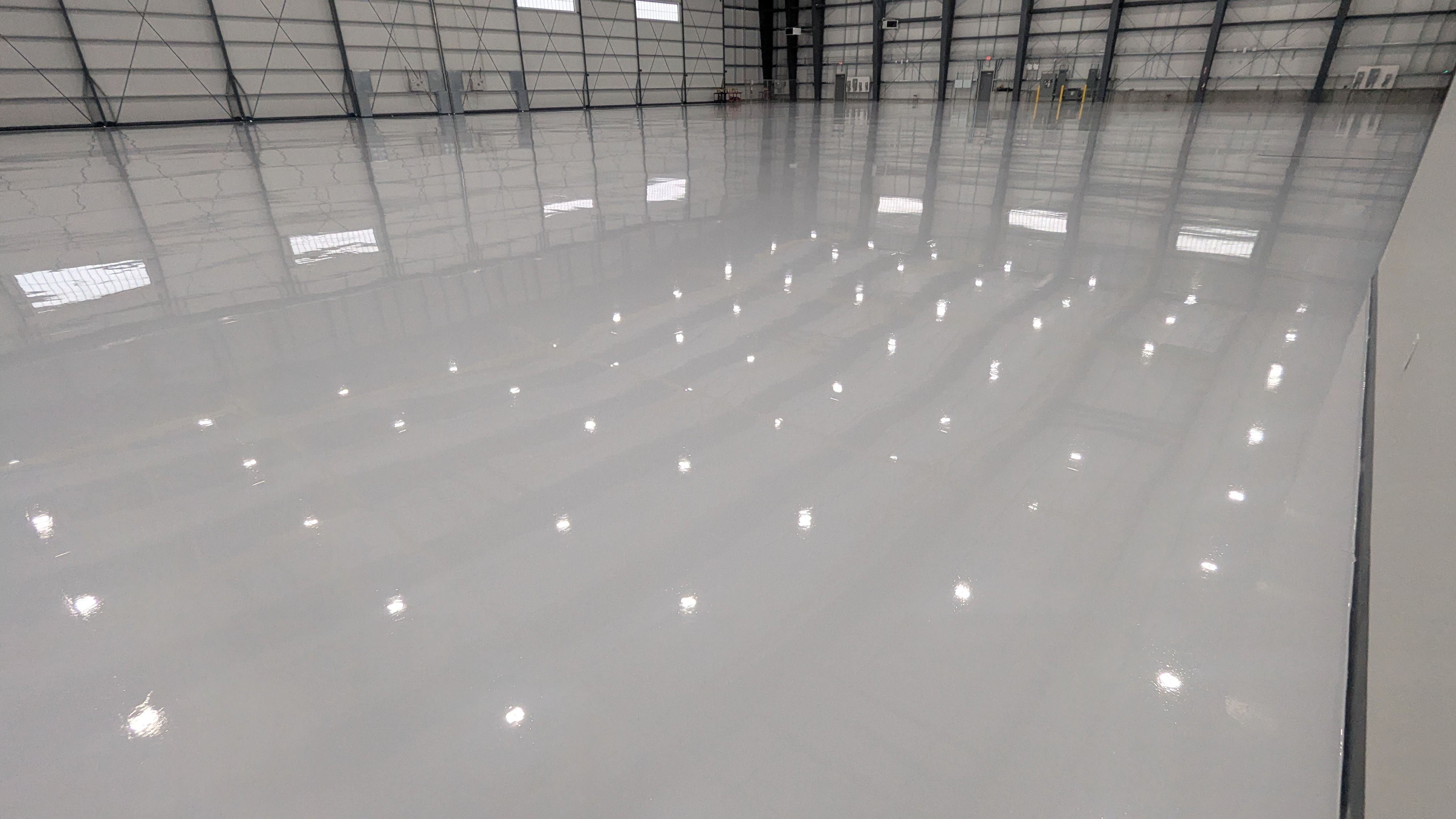 Airplane Hanger using Light Grey Commercial Penntek Epoxy by Croc Coatings, LLC