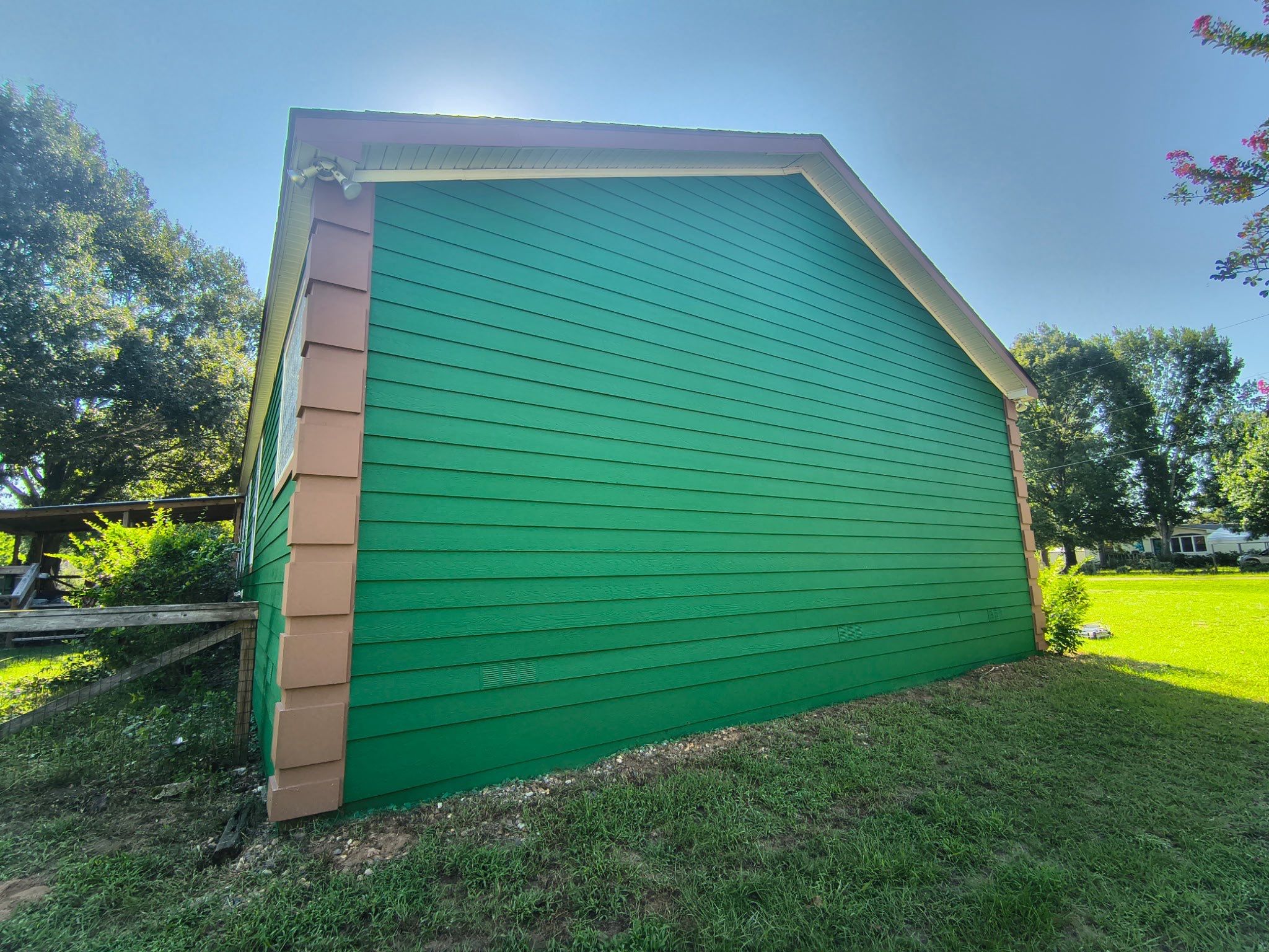 Exterior Painting in Lindale, TX | Bright Green Wood House Repaint by Quality Coats Painting