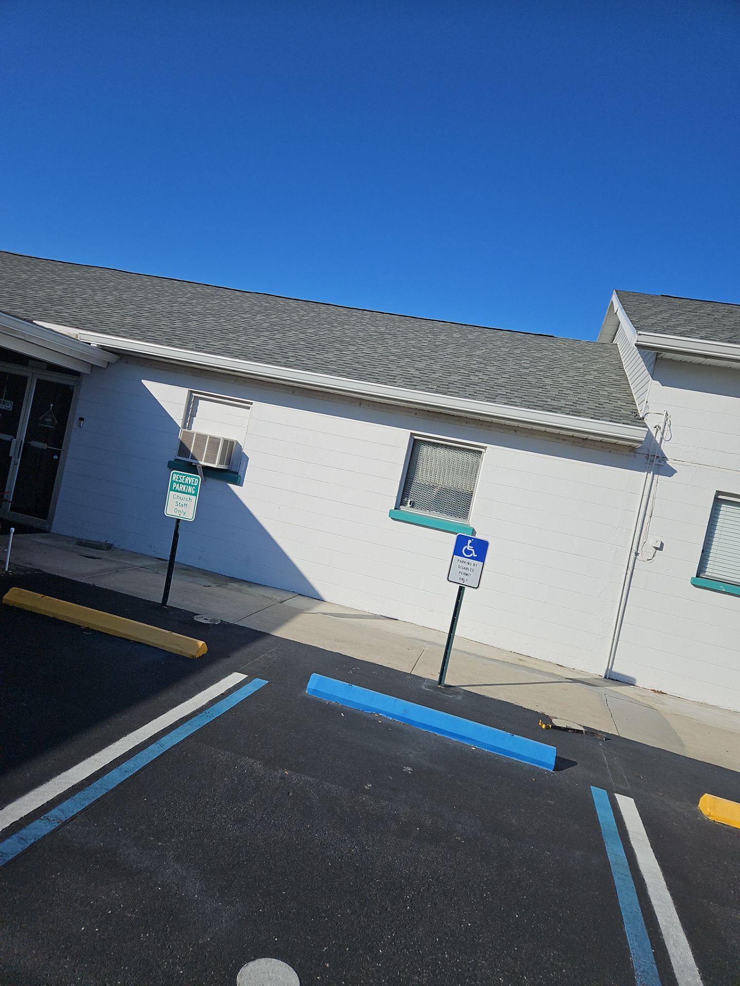 Downspout Installation using White Down Spouts in Sarasota FL by Gutter Professors