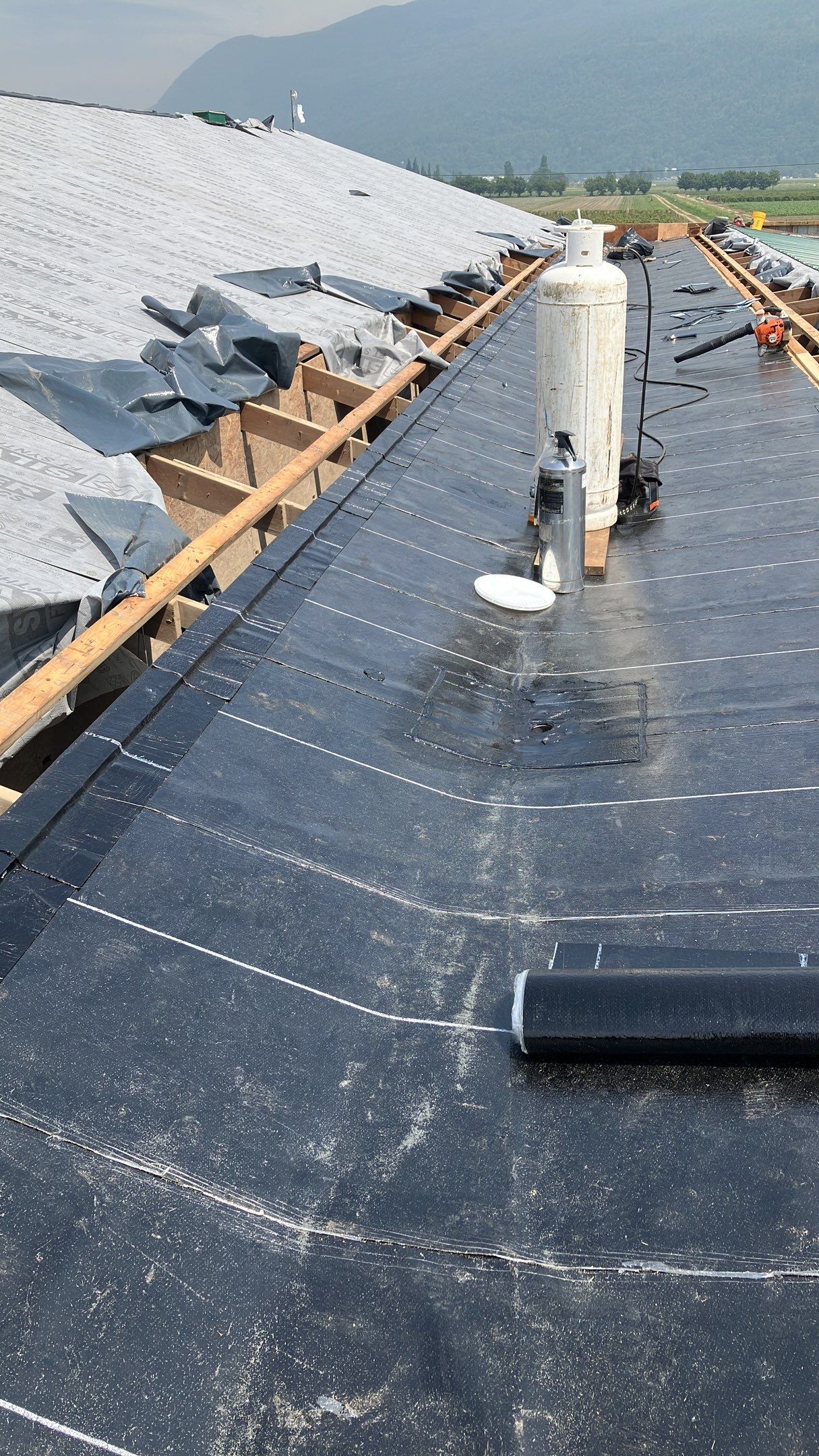 Residential Roofing Installation using IKO 2ply sbs on existing building by Top Notch Roofing Inc