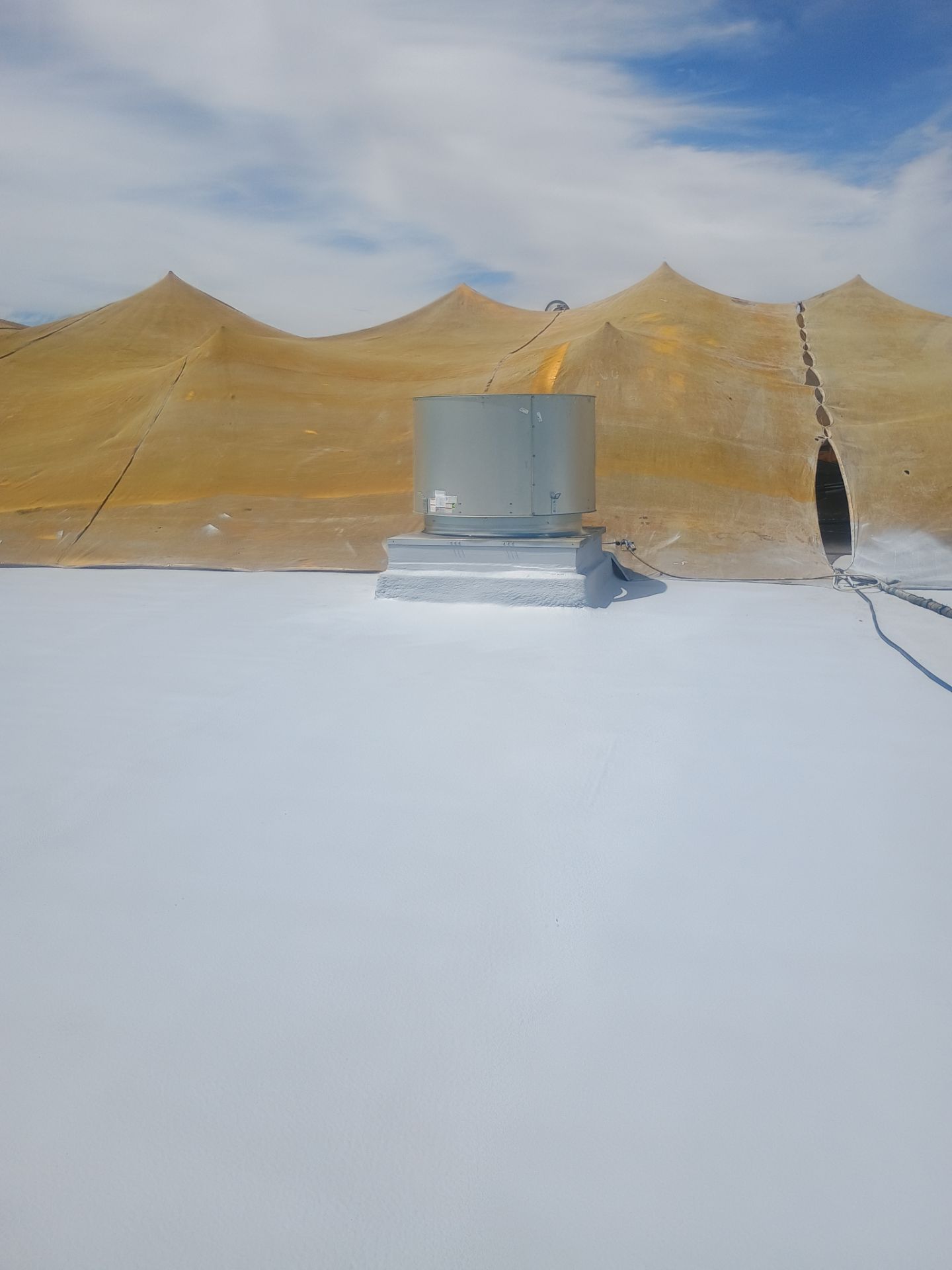 Pro Farms Spray foam roofing project by Straight Edge Roofing Inc