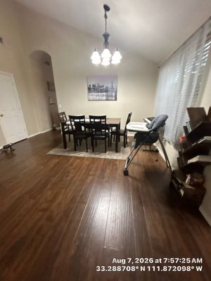 Modern Dining Room Renovation With Dark Wood Floors and Lighting
