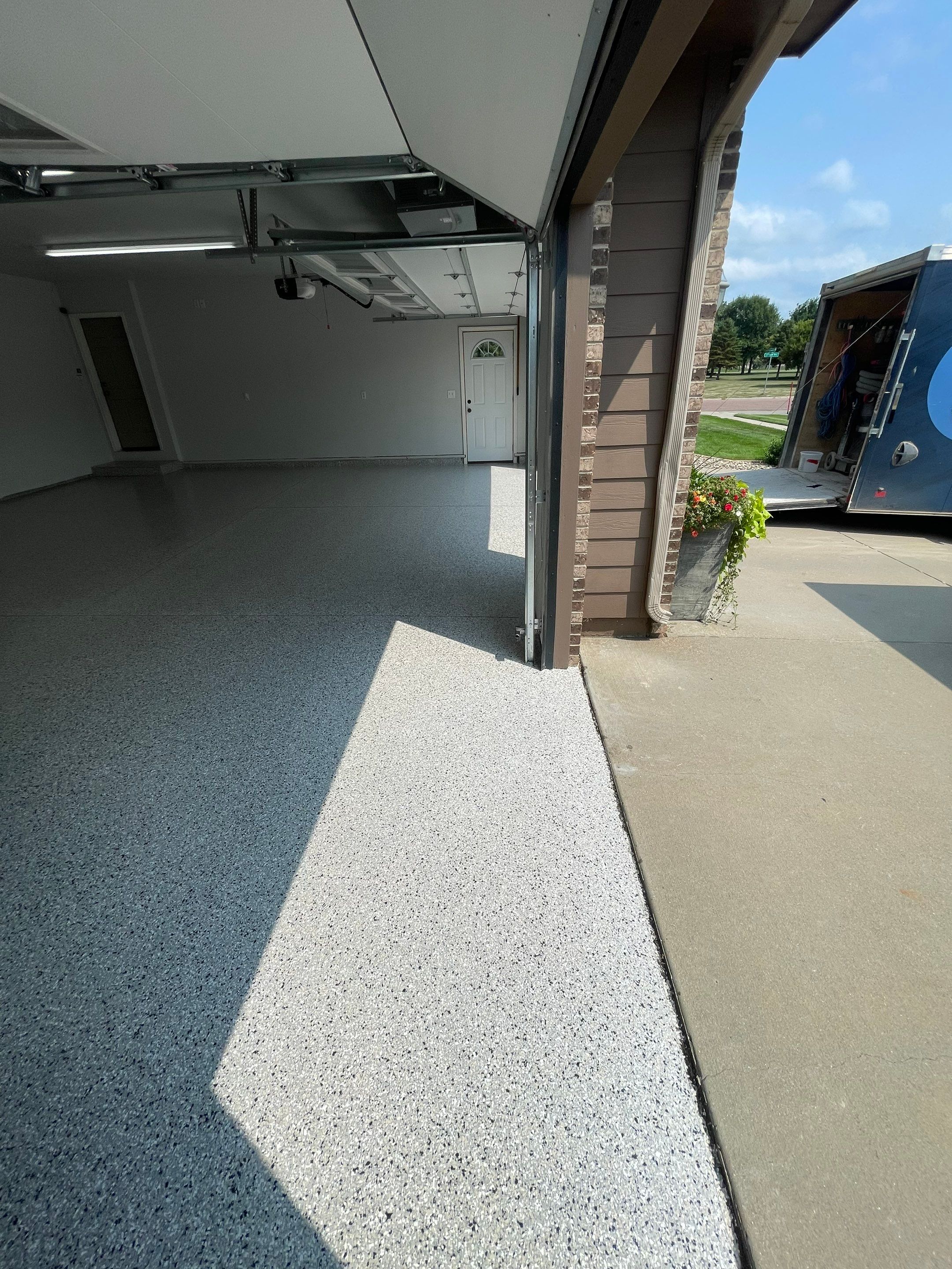 Multi-Car Garage Floor Coating and Crack Repair in Tea by Select Painting, Coatings & Garage Cabinets