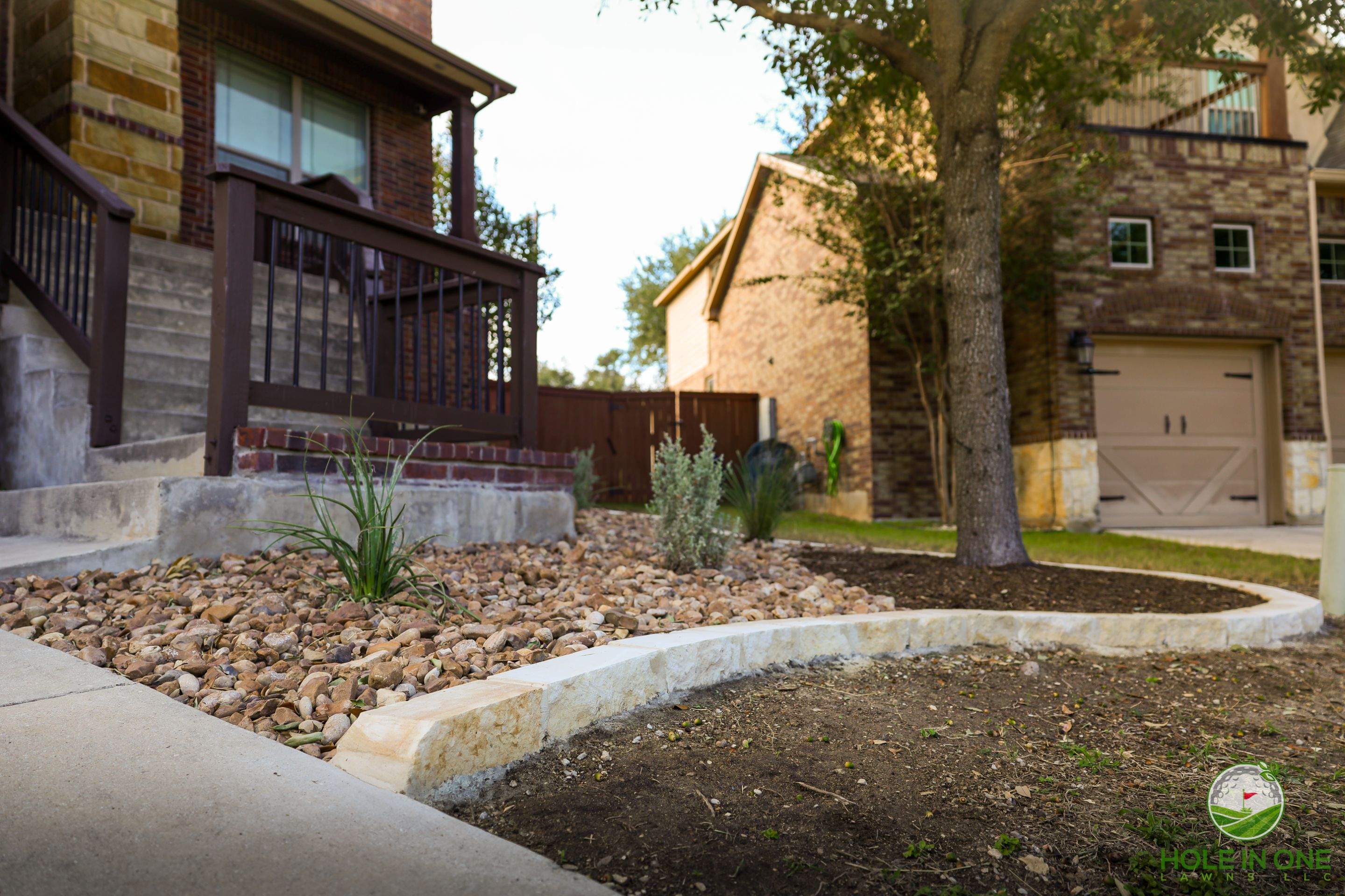 Low-Maintenance Front Yard Xeriscape with Chopstone Border, North San Antonio TX by Hole In One Lawns, LLC