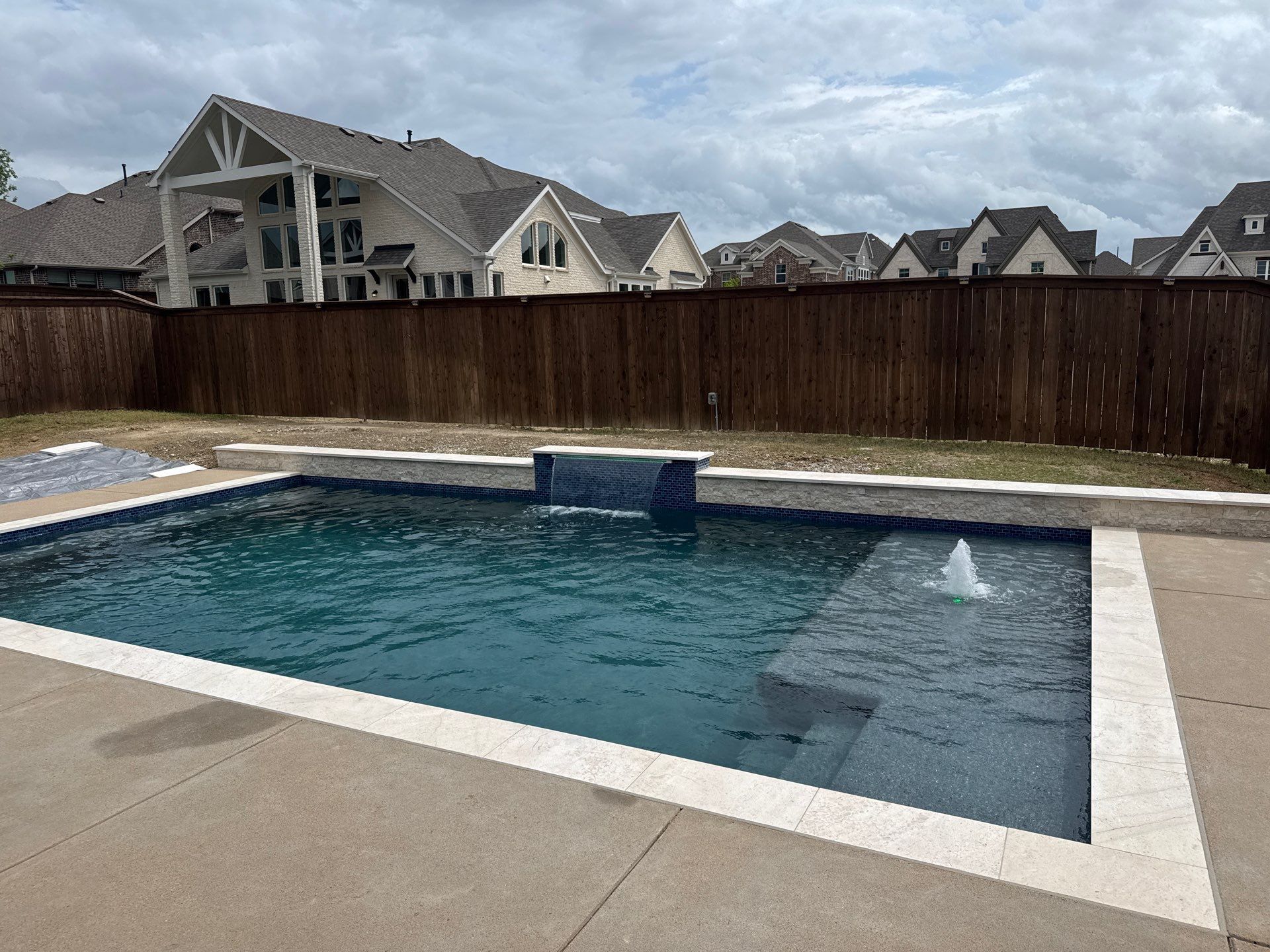 Geometric Pool with Tanning Ledge and Bubbler by Pinnacle Pools and Spas - DFW