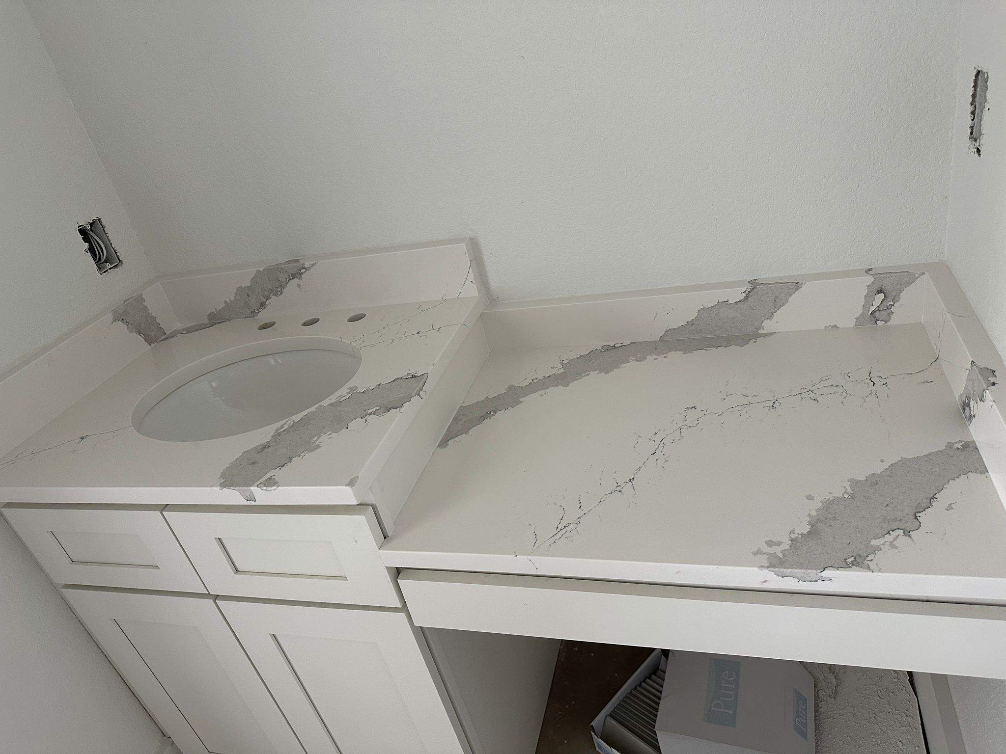 Kitchen and Bathroom Countertop Upgrades Featuring Gray Veined Quartz
