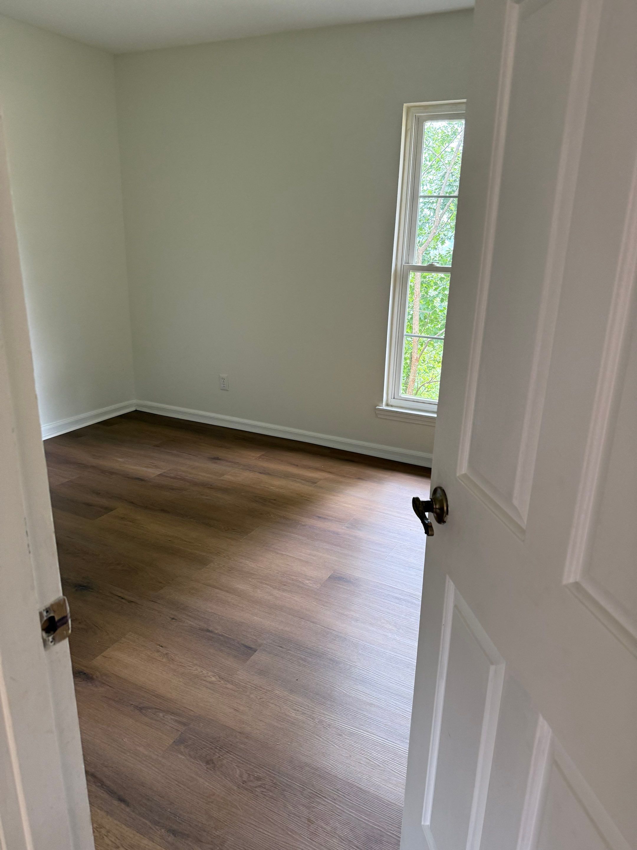 Complete Home Remodel Featuring Custom Kitchen and Wood-Look Plank Flooring by MAJO