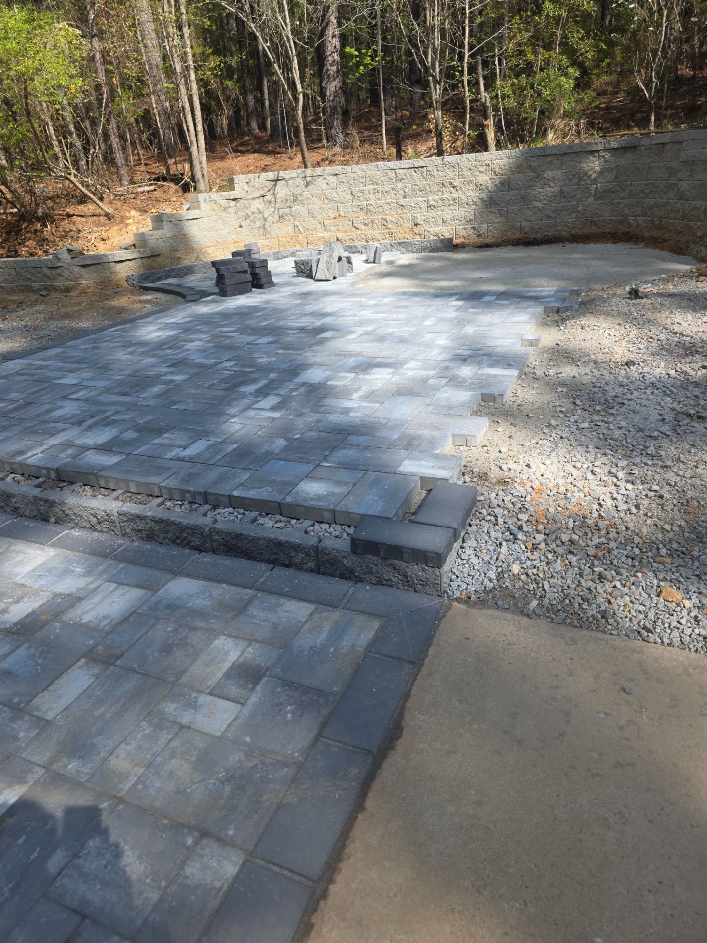 Pittsboro Outdoor Living Transformation – Retaining Wall, Paver Patio & Elevated Deck by Elite Remodeling and Design LLC