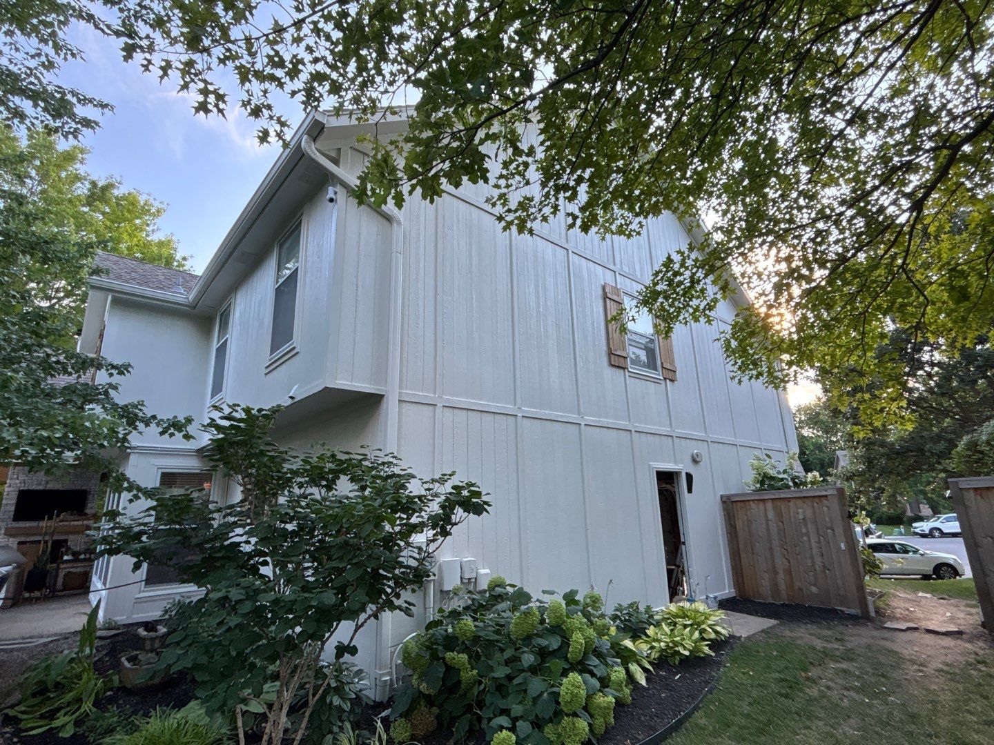 Shoji White Exterior Painting and Comprehensive Wood Rot Repair in Overland Park by Cougar Painting