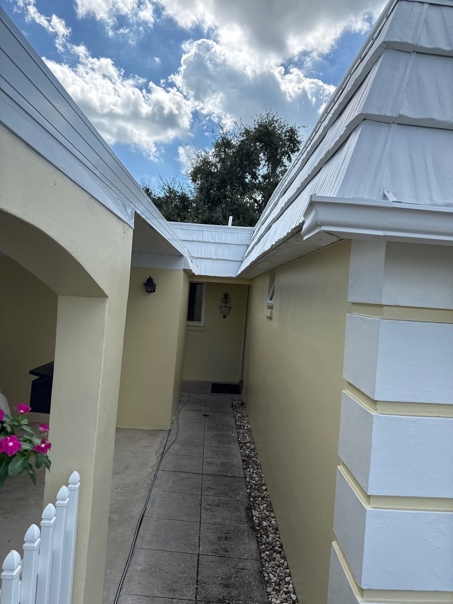 White Gutters and Matching Downspouts in Sarasota FL by Gutter Professors