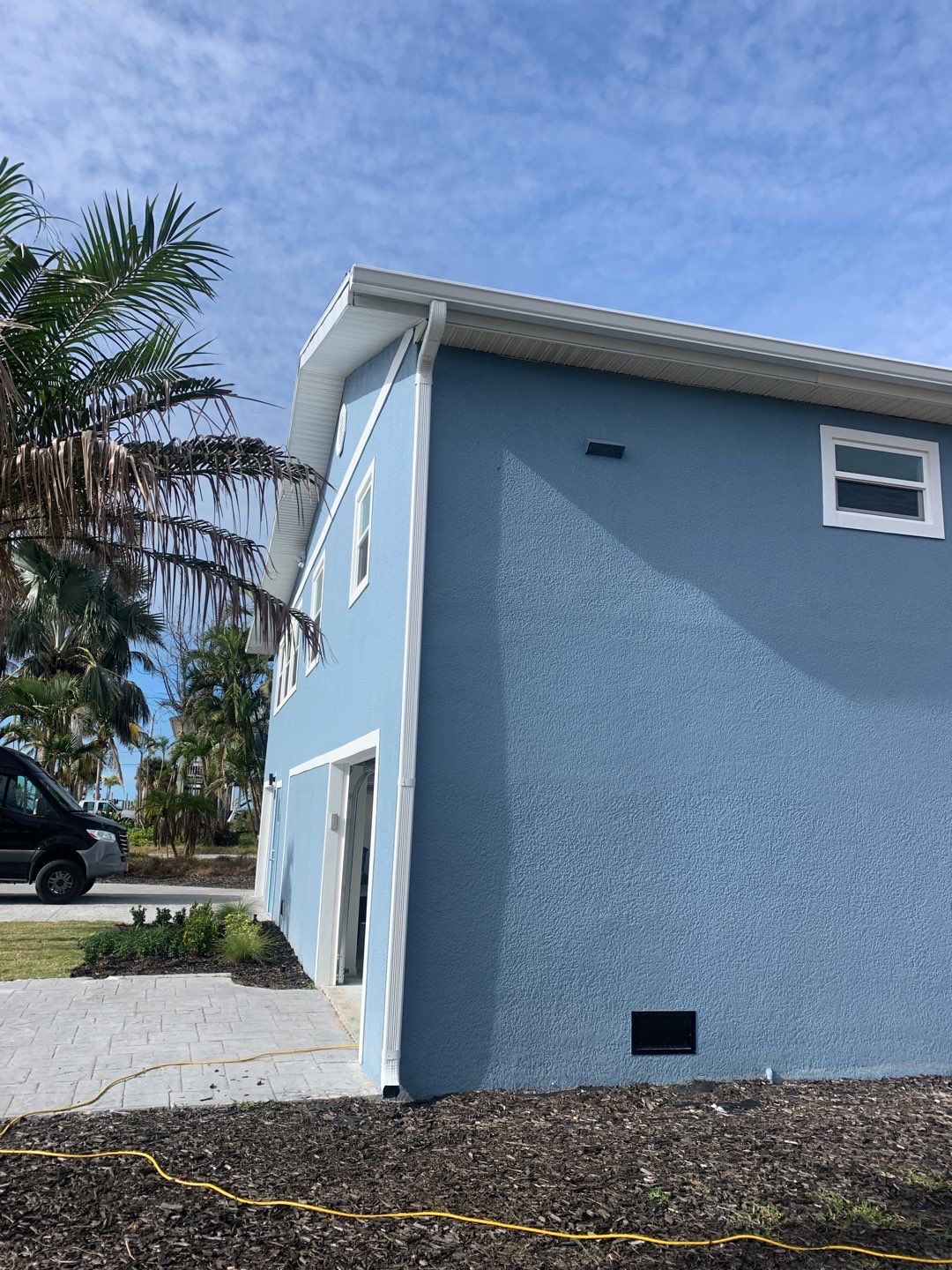 Downspout Installation for Two-Story Home in Fort Myers FL by Gutter Professor by Gutter Professors