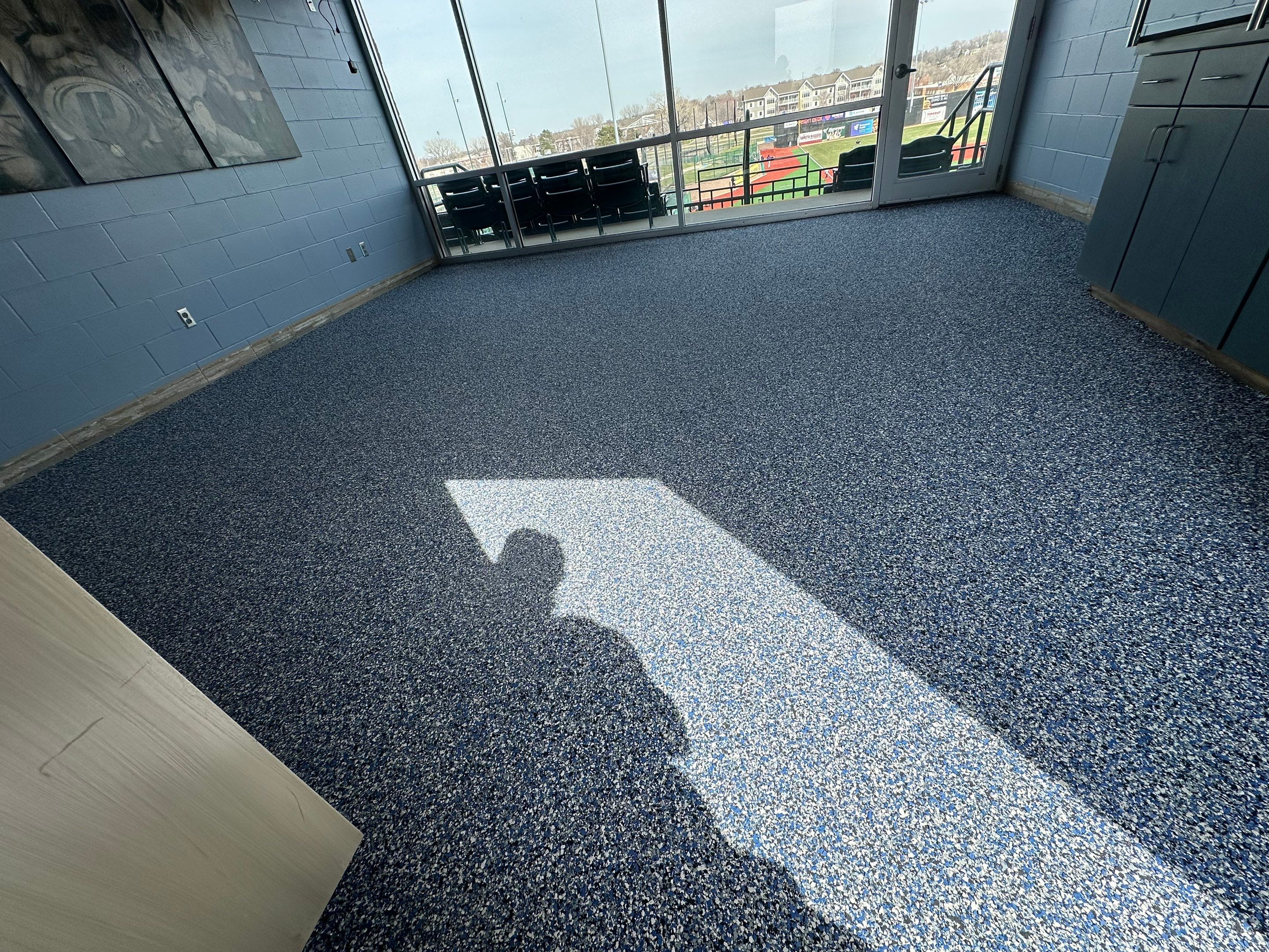 Commercial Epoxy Floor Coating for Stadium Viewing Suites in Sioux Falls by Select Painting, Coatings & Garage Cabinets