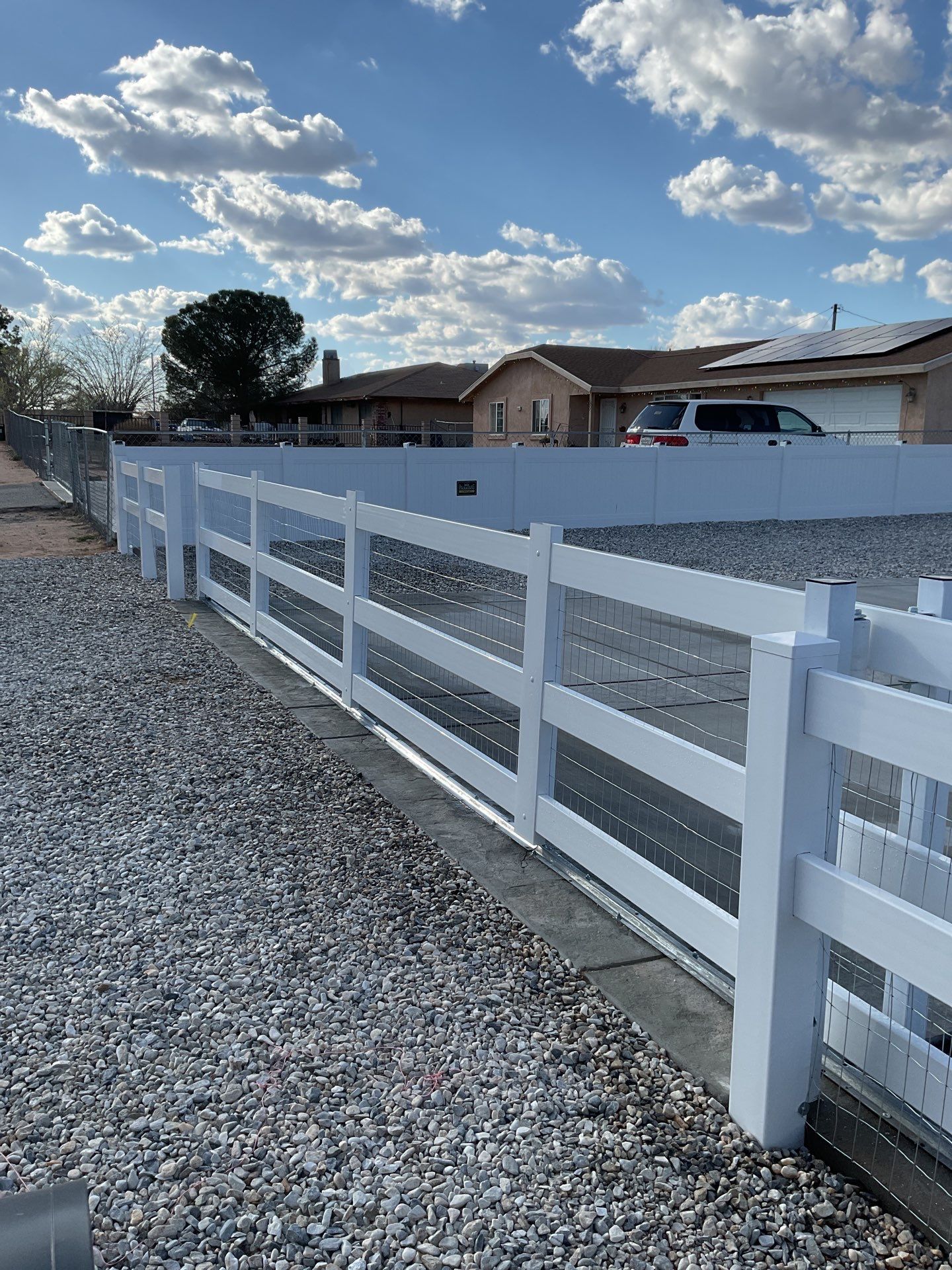 Wrought Iron Frame Ranch Style Sliding Gates by Fence Guys Inc.