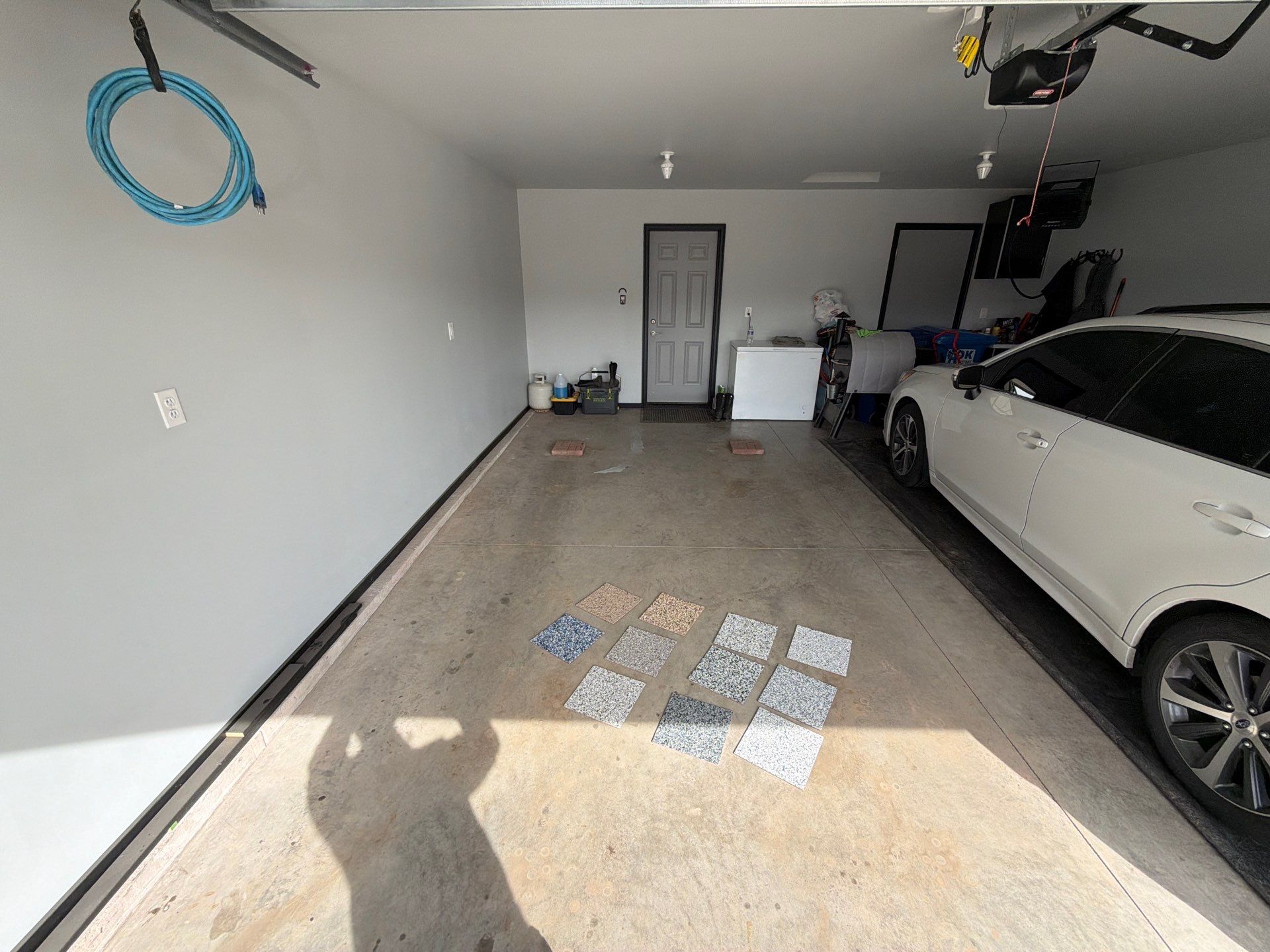 Custom Epoxy Garage Floor Coating Installation in Sioux Falls by Select Painting, Coatings & Garage Cabinets