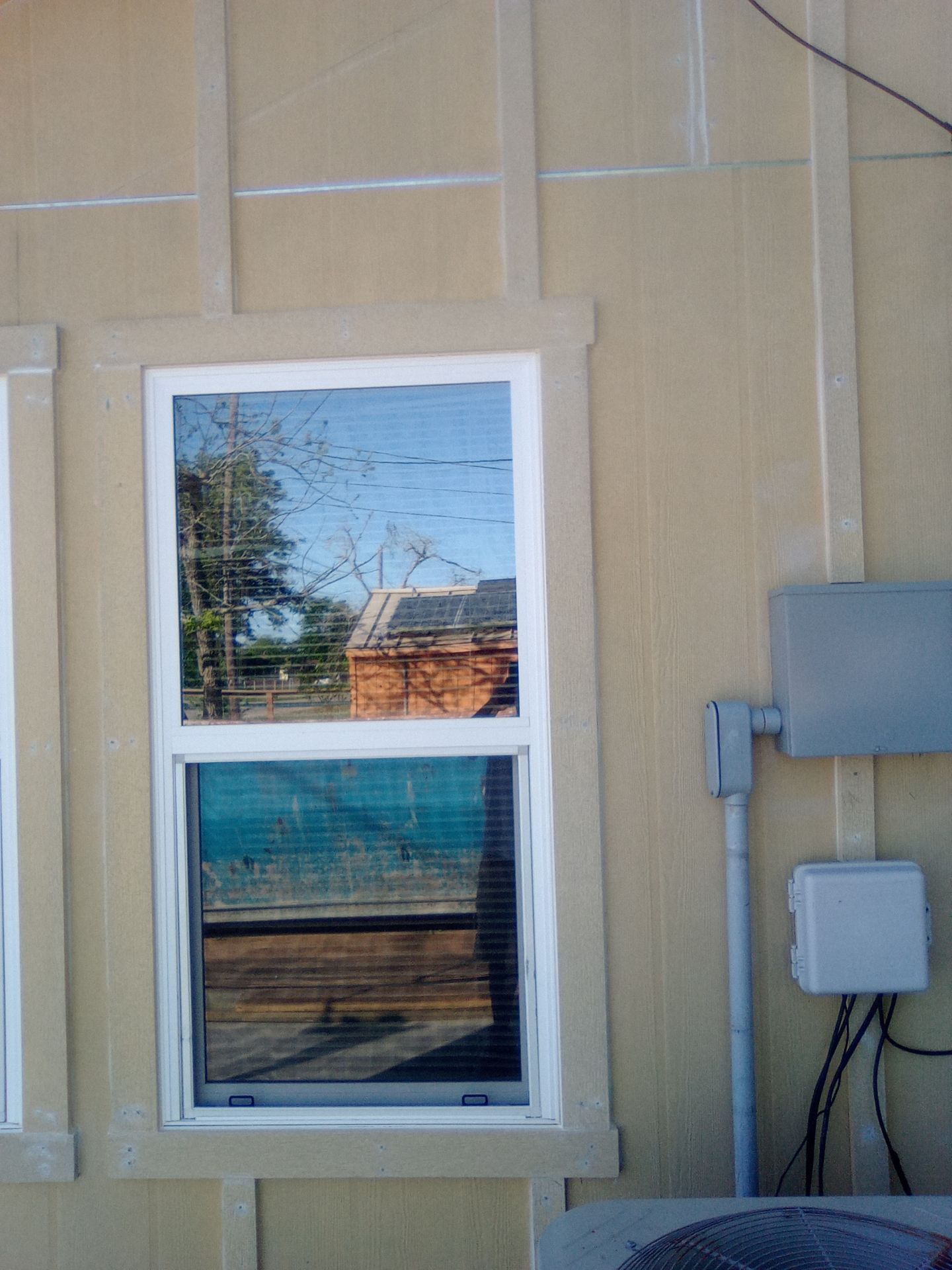 Vinyl to Hardie by Bayfront Roofing and Construction