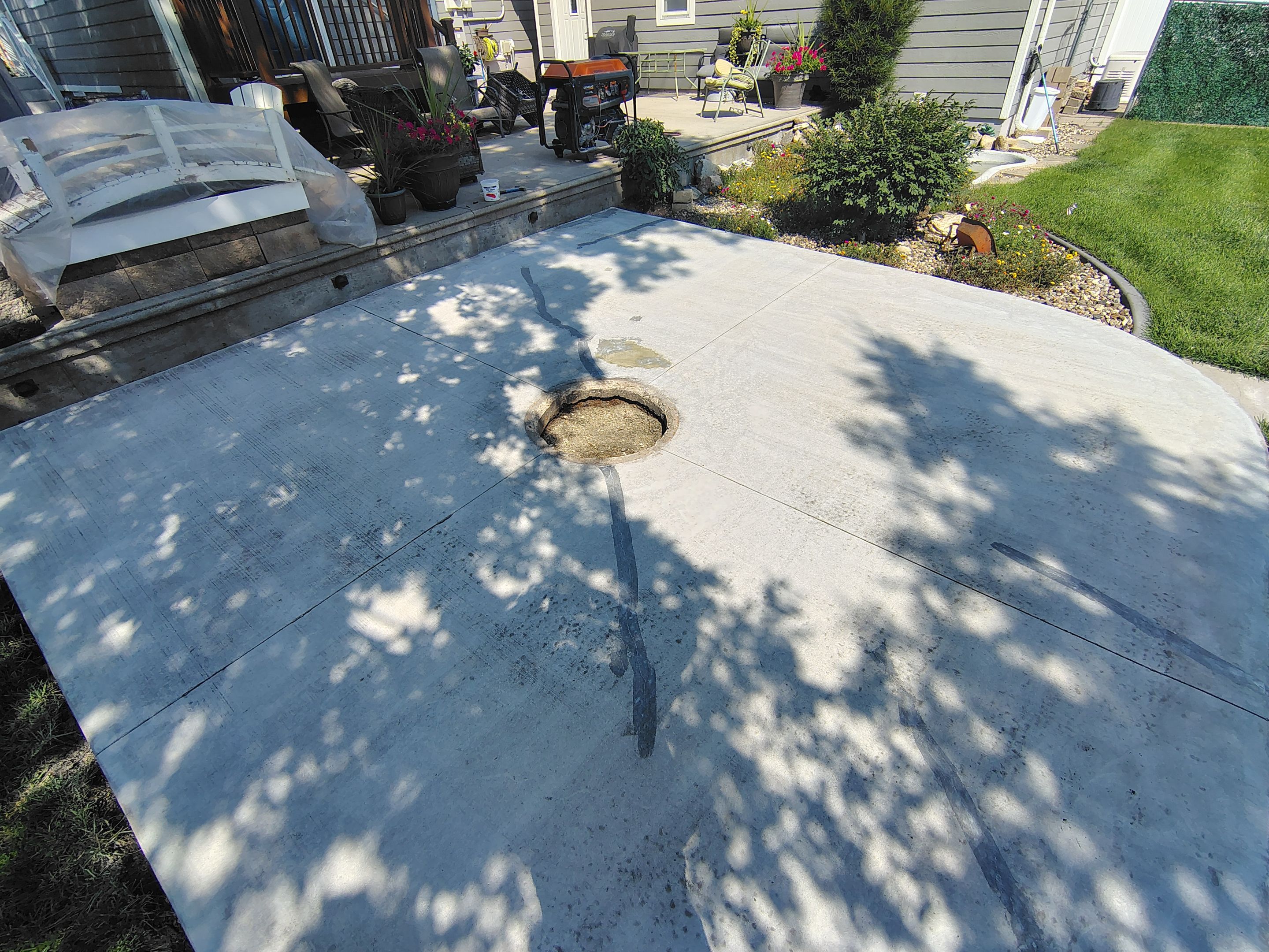 Custom Garage Floor Coating and Backyard Patio Refinishing in Tyndall by Select Painting, Coatings & Garage Cabinets