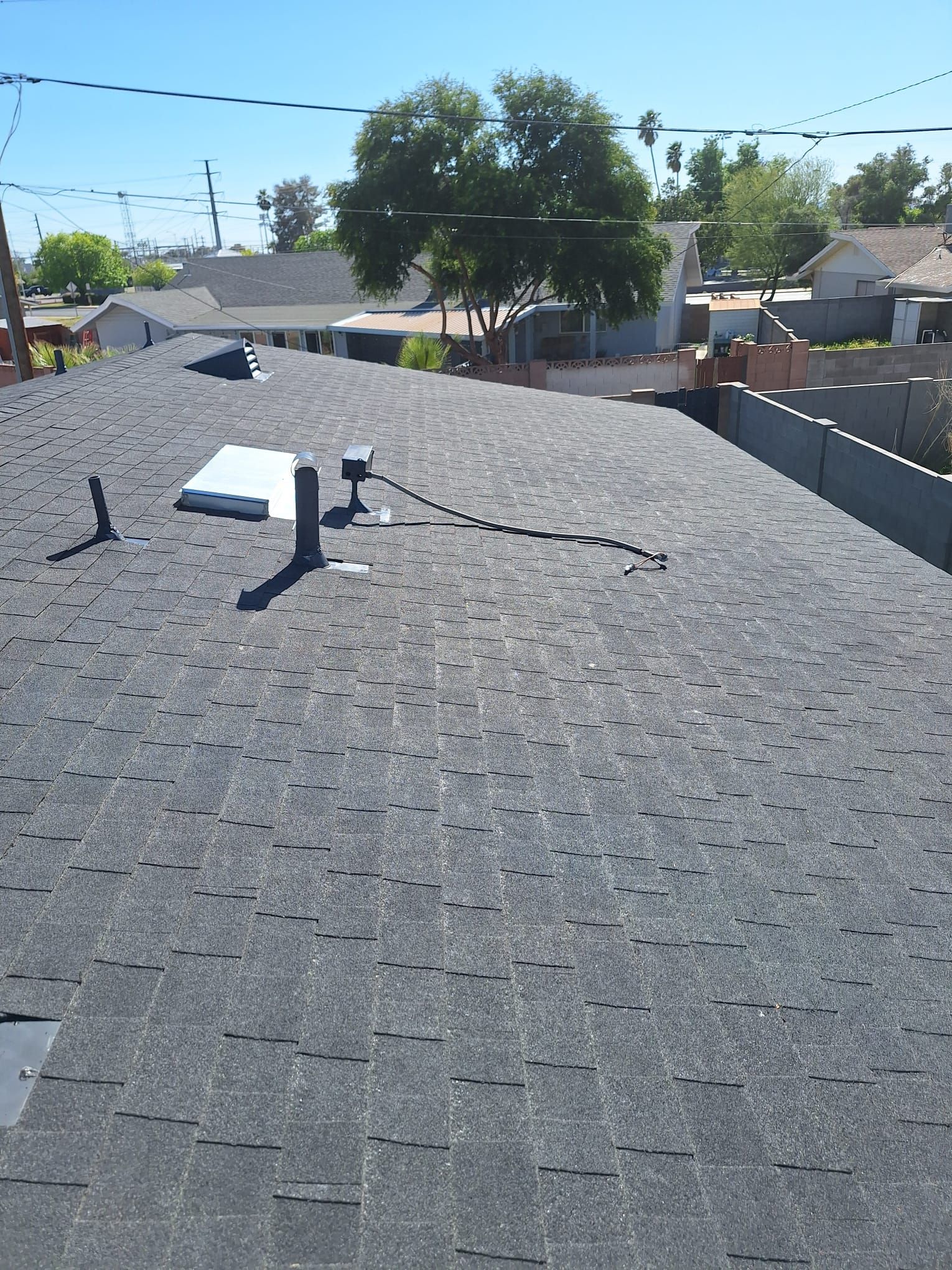 Onyx Black Shingles by Reimagine Roofing