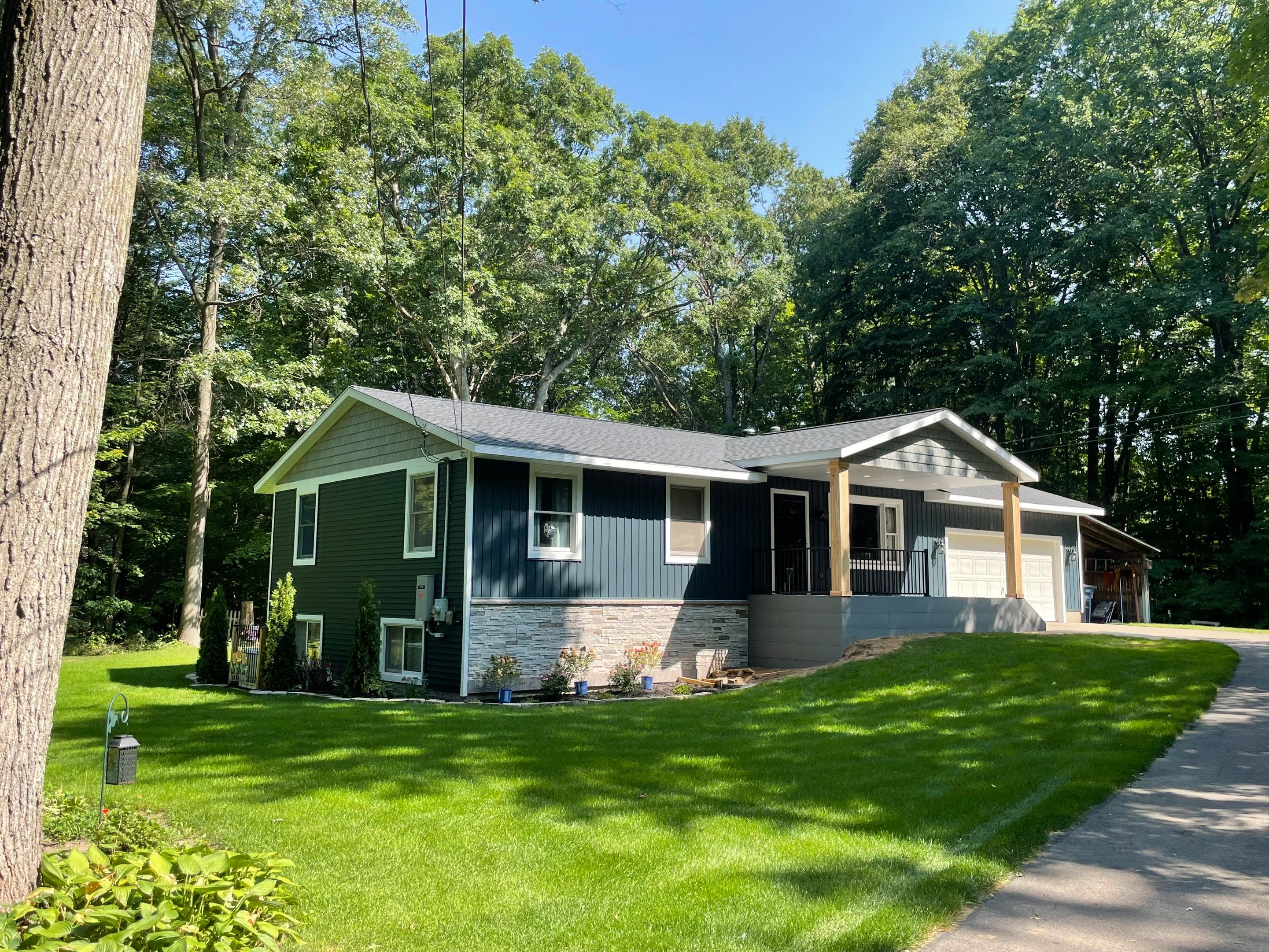 Siding, Deck and Versetta Stone by Avalon Roofing and Exteriors