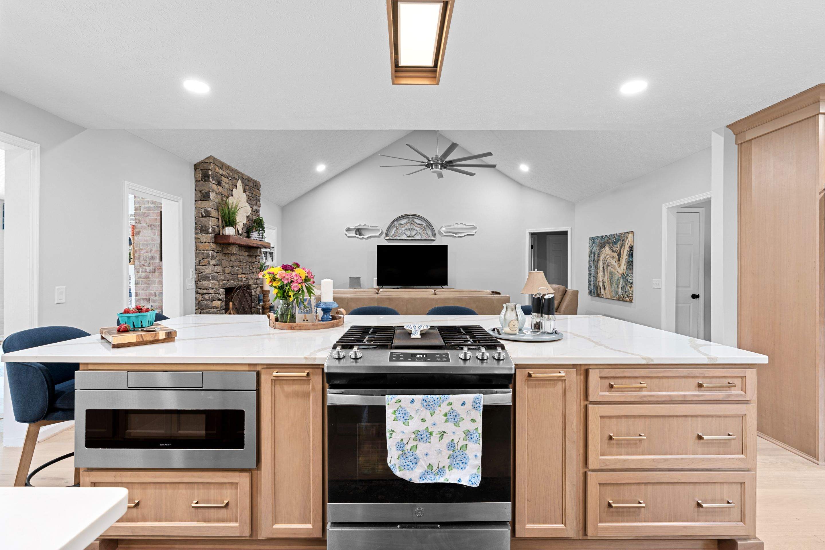Modern Kitchen Remodel Featuring Quartz Backsplash, under cabinet lighintg, and a coffee bar in Mt. Juliet Tennessee by DeRo Renovations,LLC
