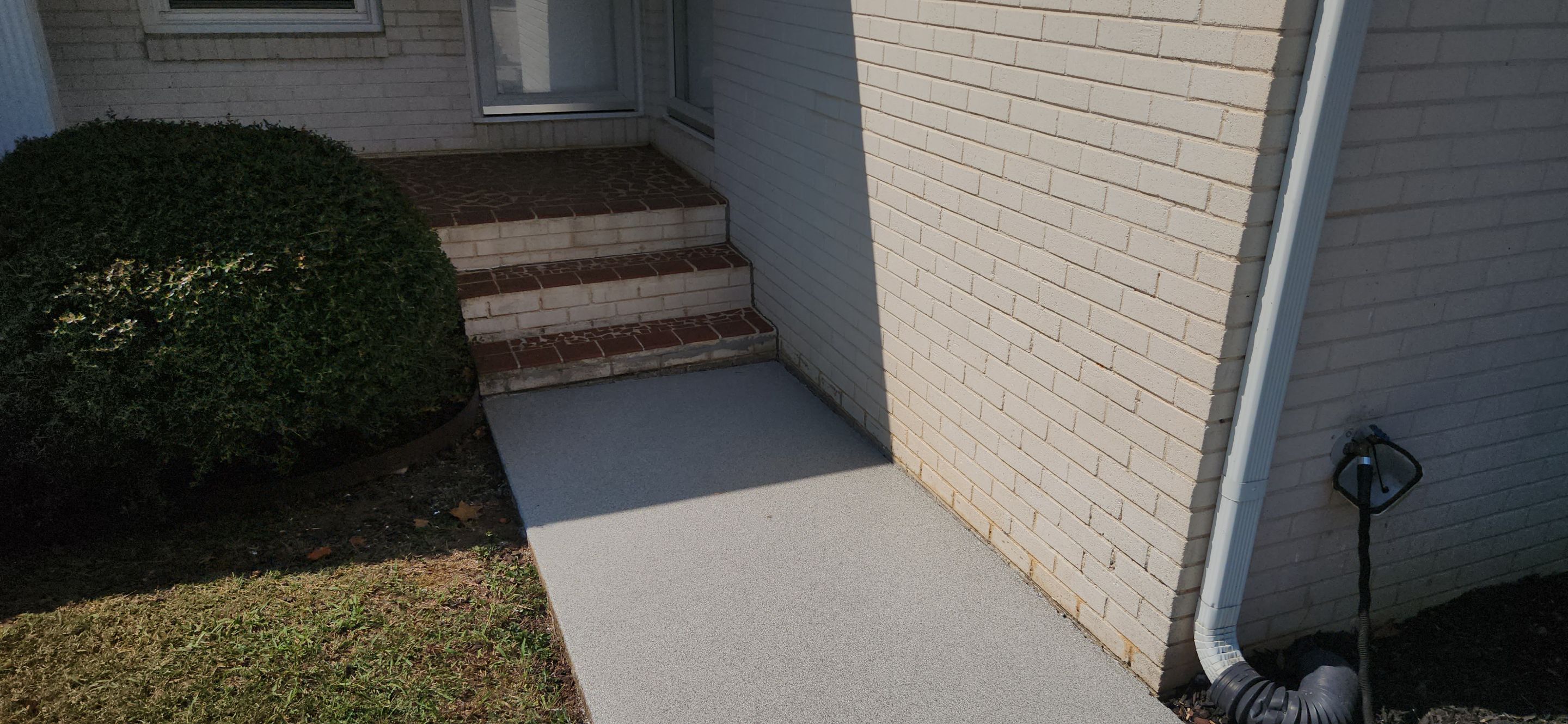 Sidewalk & Garage using Dovetail by Elite Floor Solutions