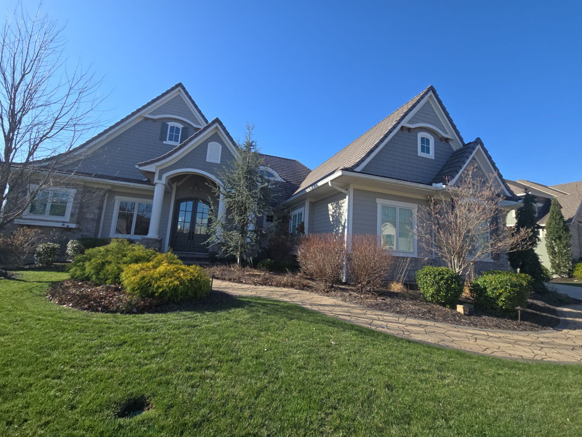 Front Yard Landscape and Walkway Renovation in Overland Park by LAND ESCAPES LLC