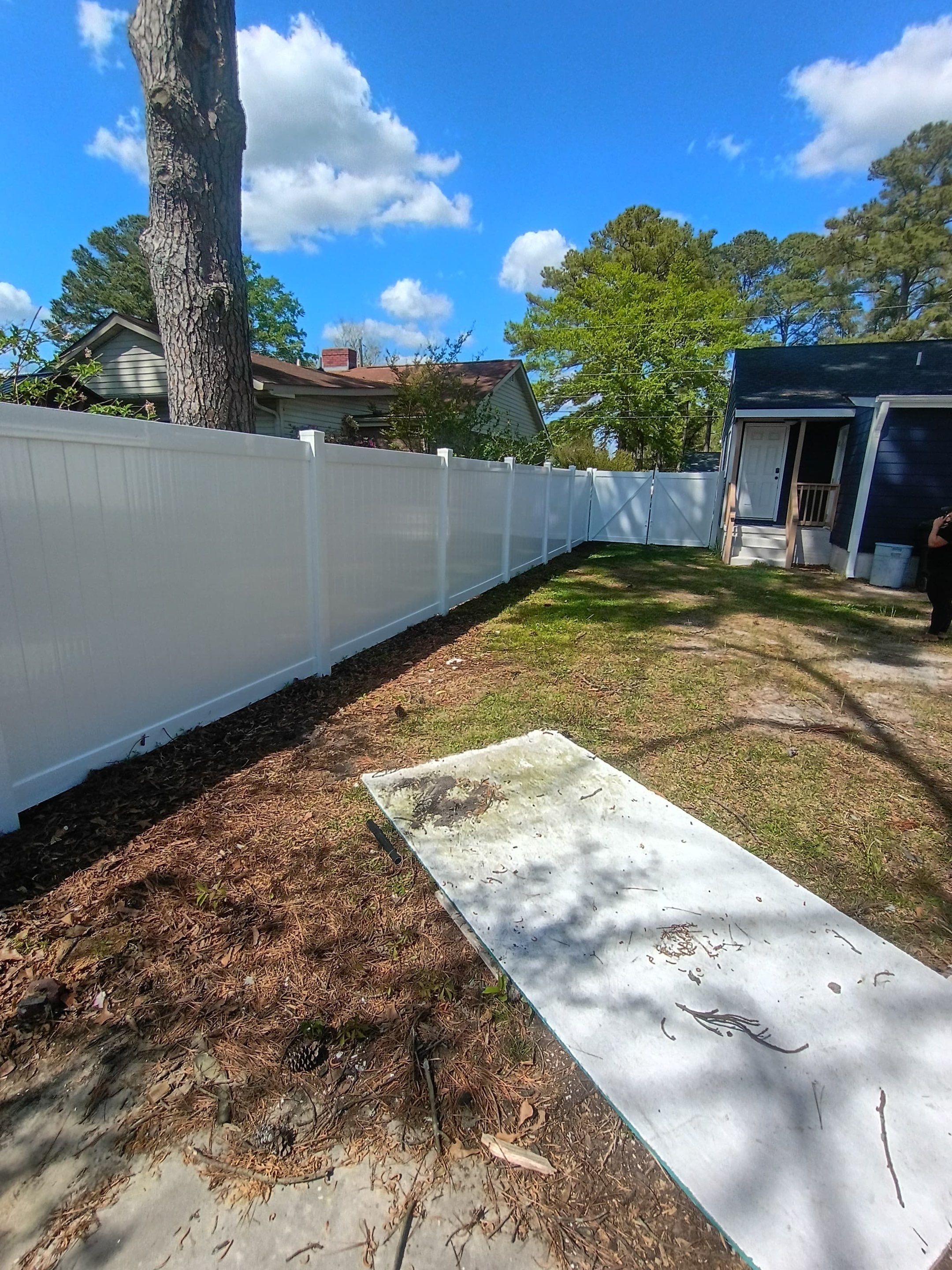 White Vinyl Privacy Fence Installation in Greenville, NC by Superior Fence and Rail
