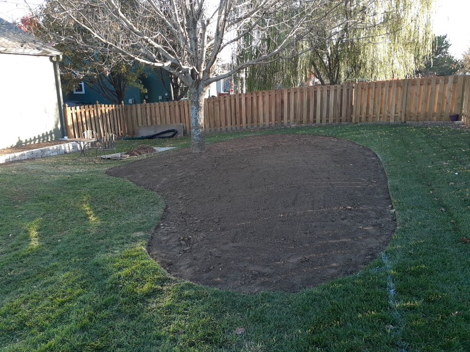 Back Yard Stamped Patio and Pergola by LAND ESCAPES LLC