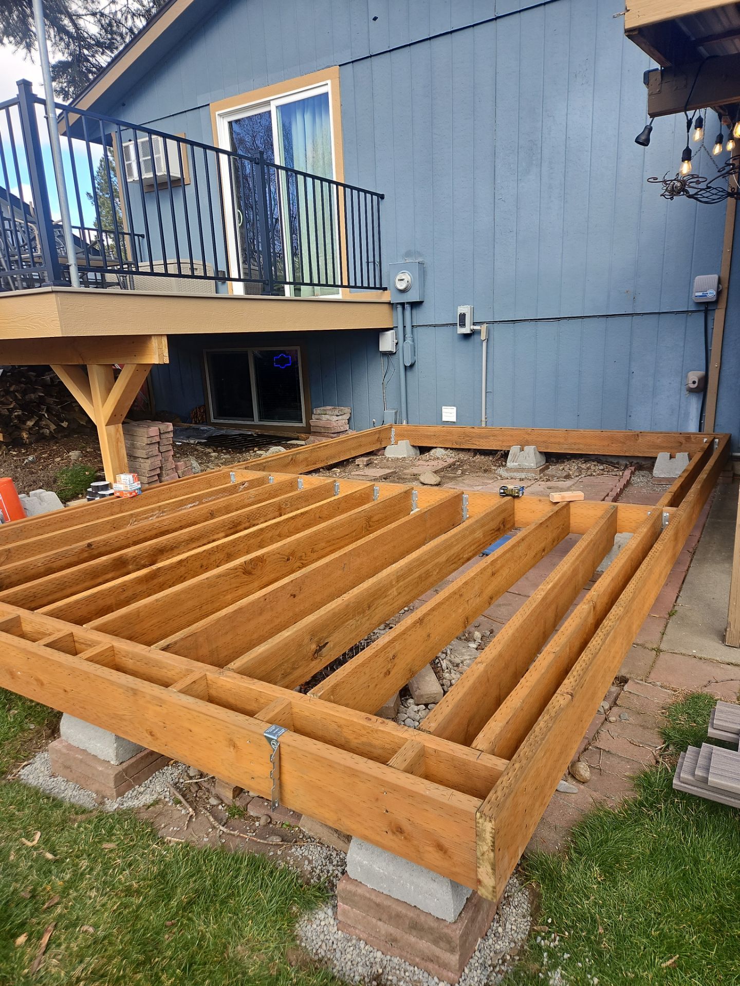 Add a platform deck below an existing elevated deck that was there prior by Home Helpers General Contracting