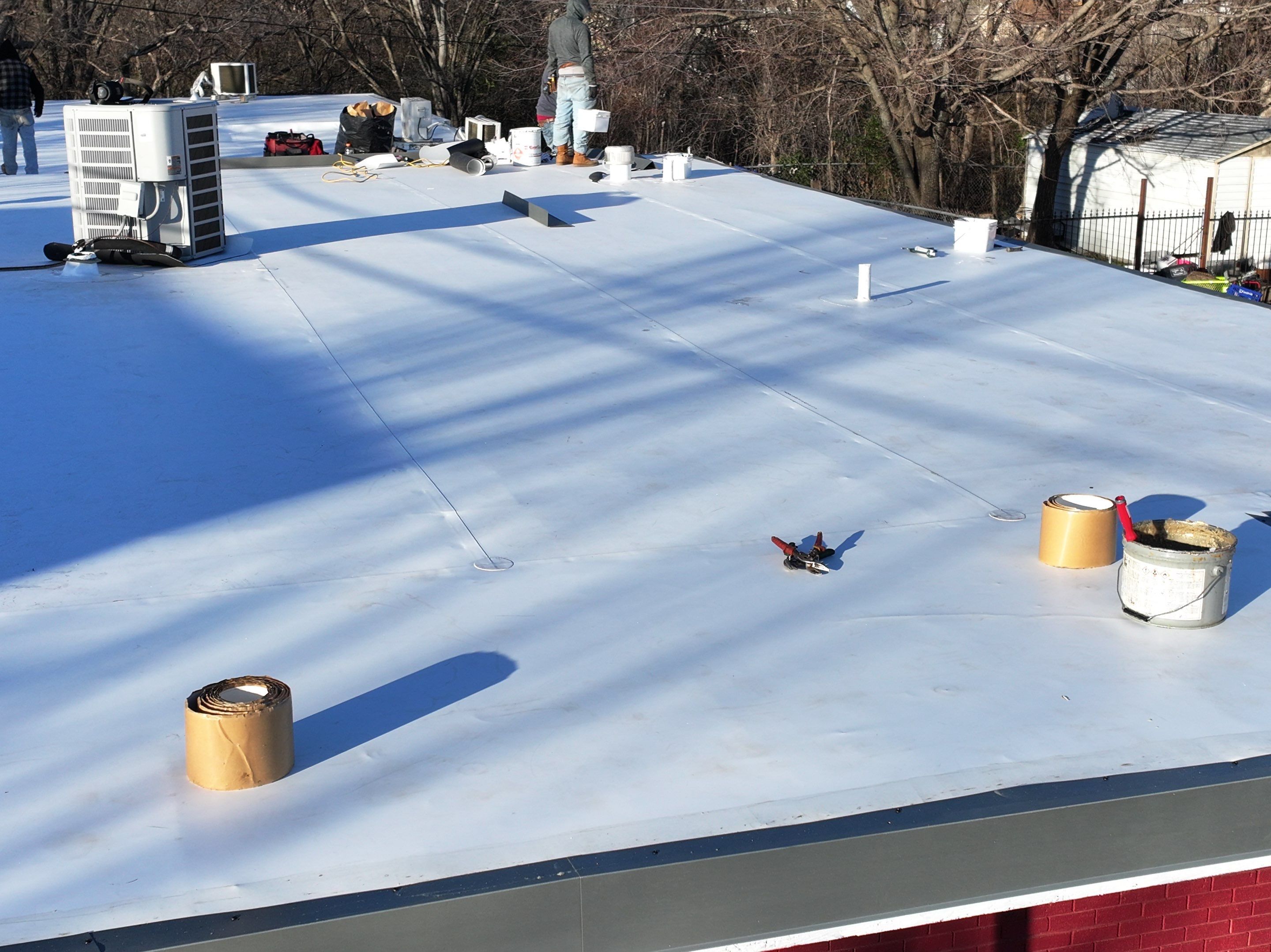 Commercial roofing overlay using GAF TPO over an old ballast roof by Becker Roofing and Exteriors