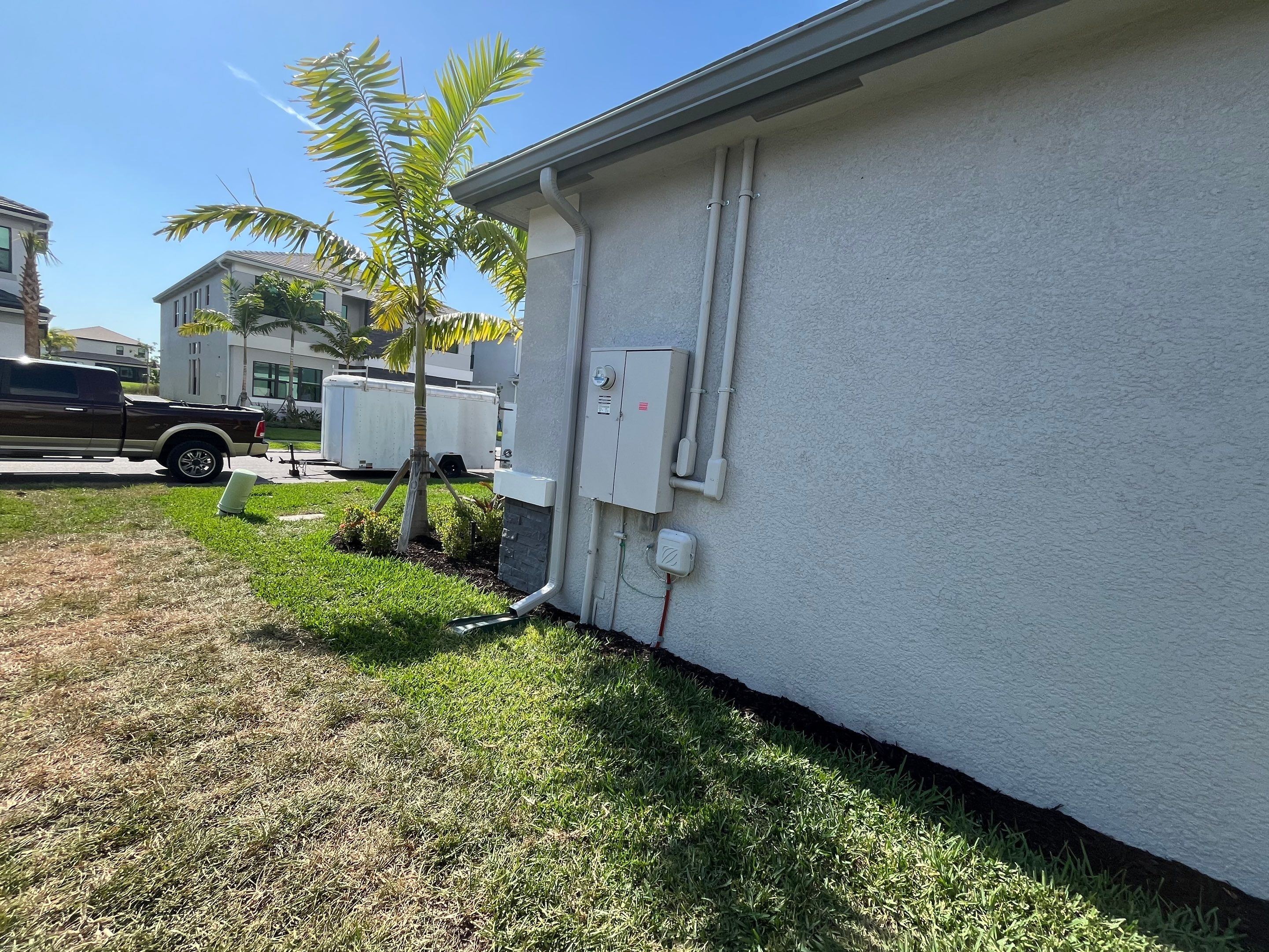 Grey Seamless Gutter Installation in Estero FL by Gutter Professors