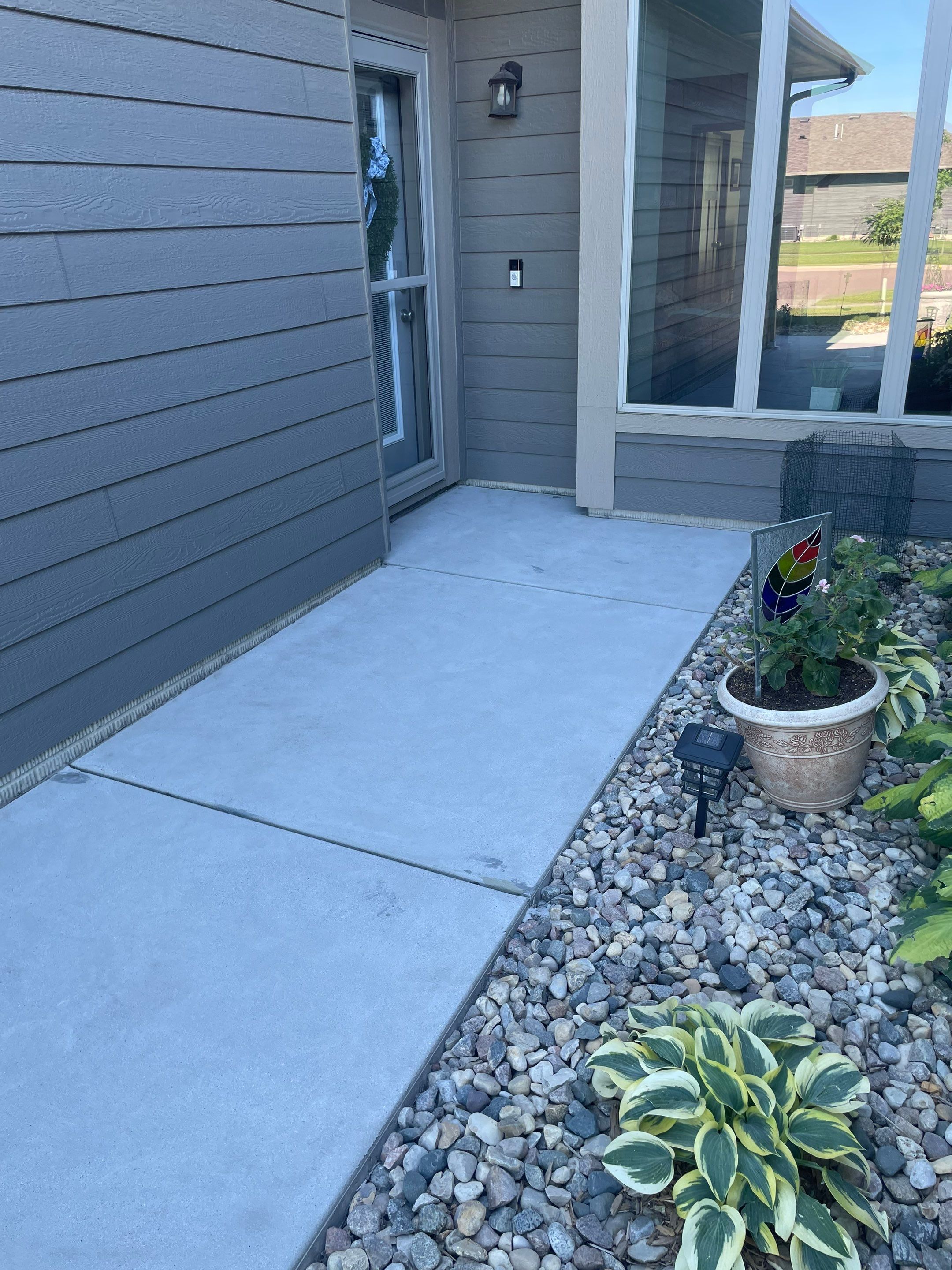 Custom Concrete Coating for Sioux Falls Patio and Front Walkway by Select Painting, Coatings & Garage Cabinets