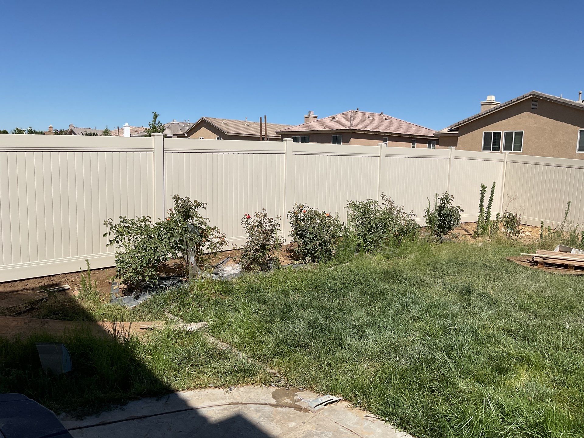 Tan Vinyl by Fence Guys Inc. 