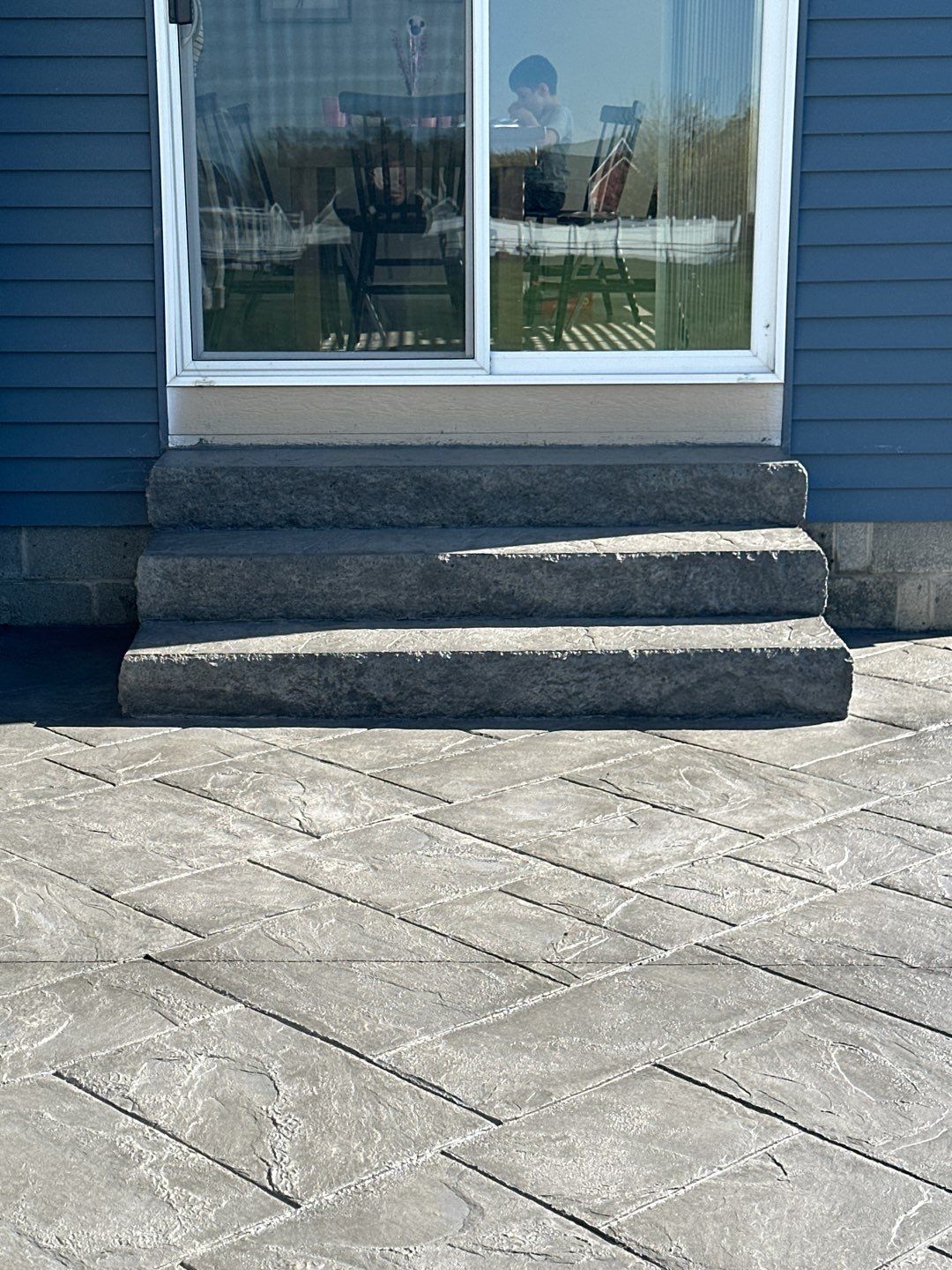 Majestic Ashlar stamped concrete patio with rock face steps  by NG Masonry & Construction LLC