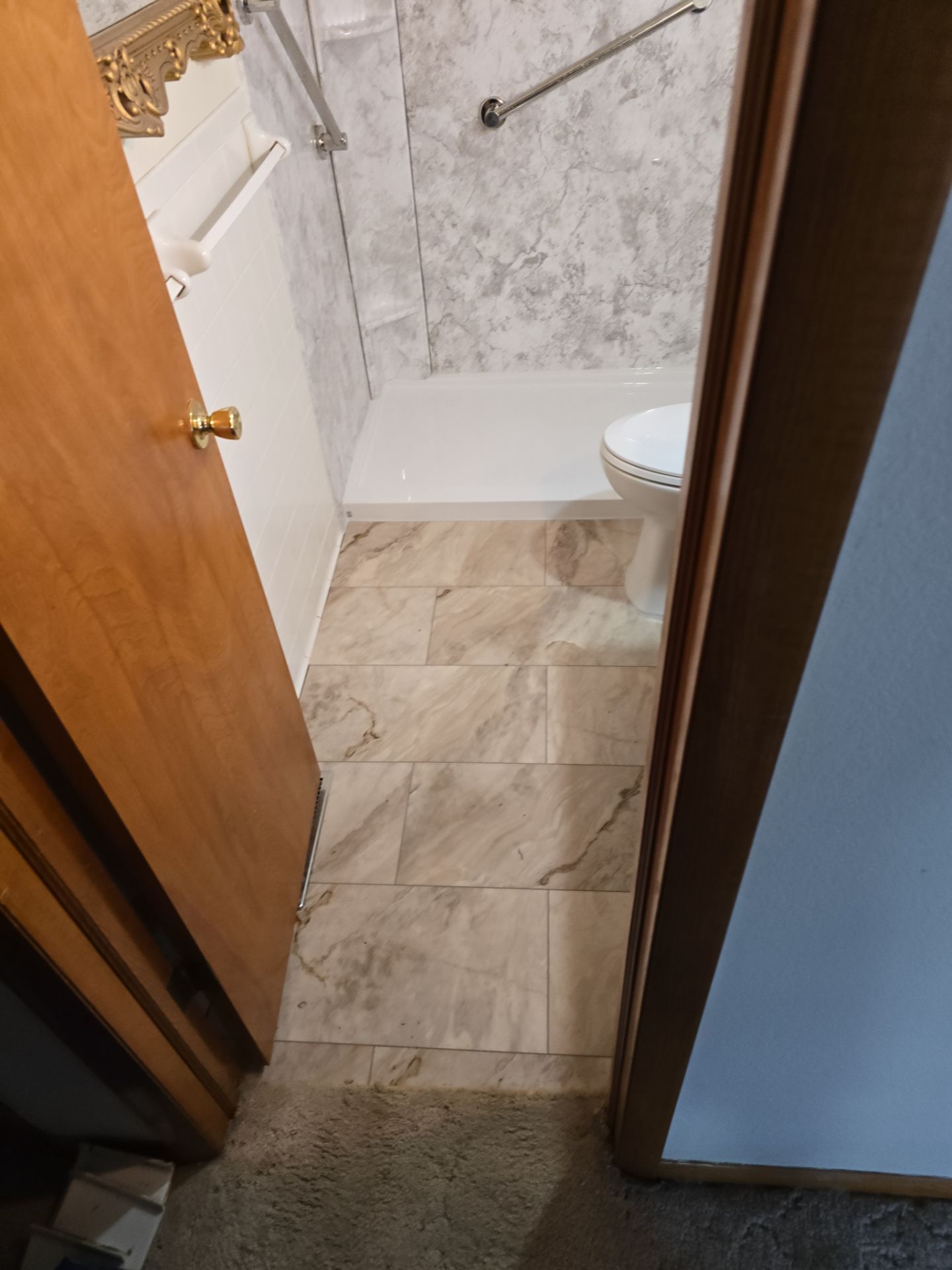 Tub to Shower , flooring, and countertop by The Shower Company