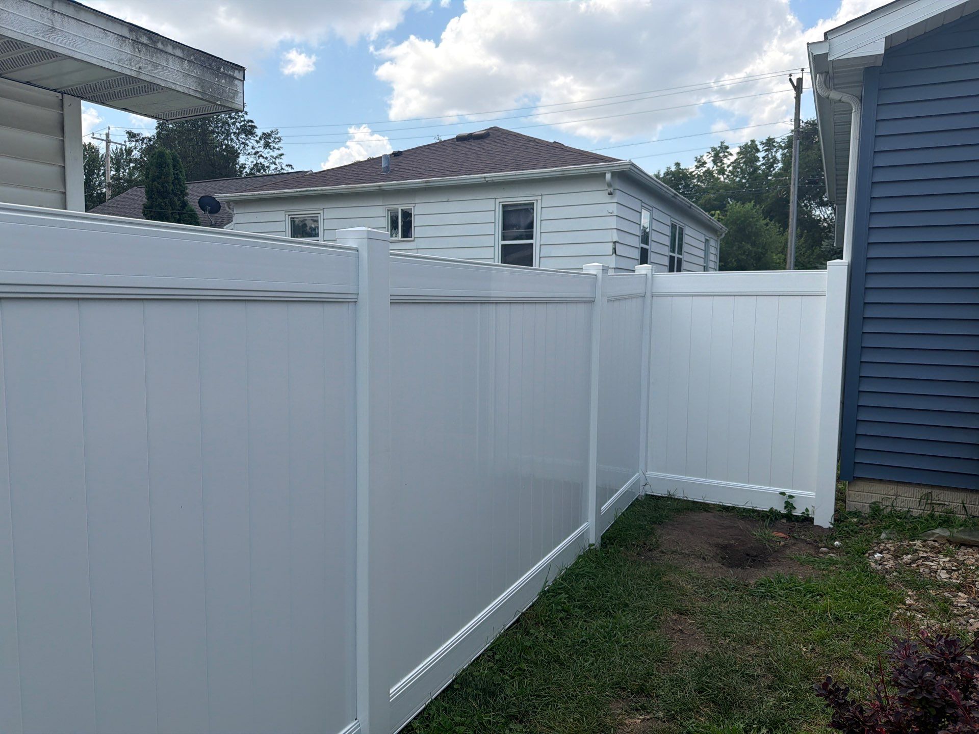 White Vinyl Privacy Fence Installation in Waterloo, Iowa by Perfect Picket Fence and Stain