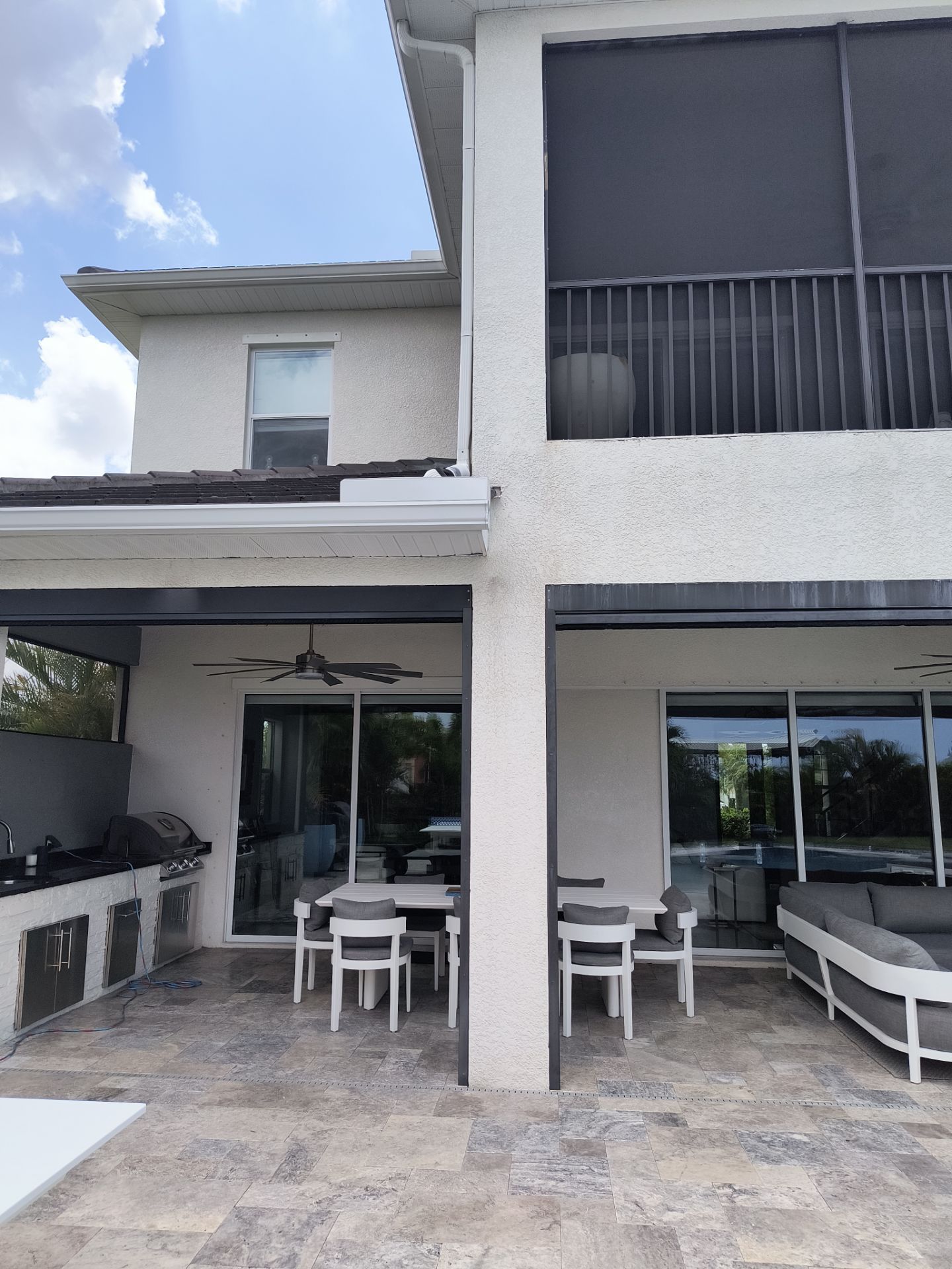 White Seamless Gutters with Downspouts in Bradenton FL by Gutter Professors