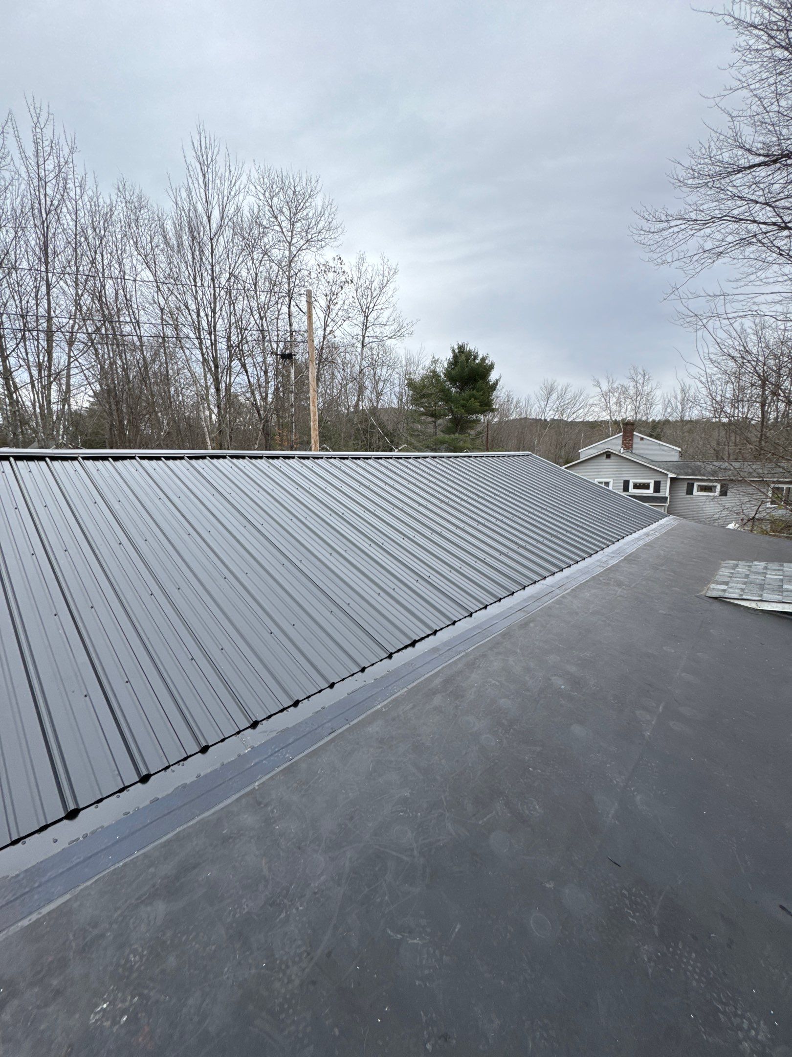 Gilford, NH Metal Roof Installation on Lake Winnipesaukee – Screw-Down Metal Roofing System by Compass exteriors