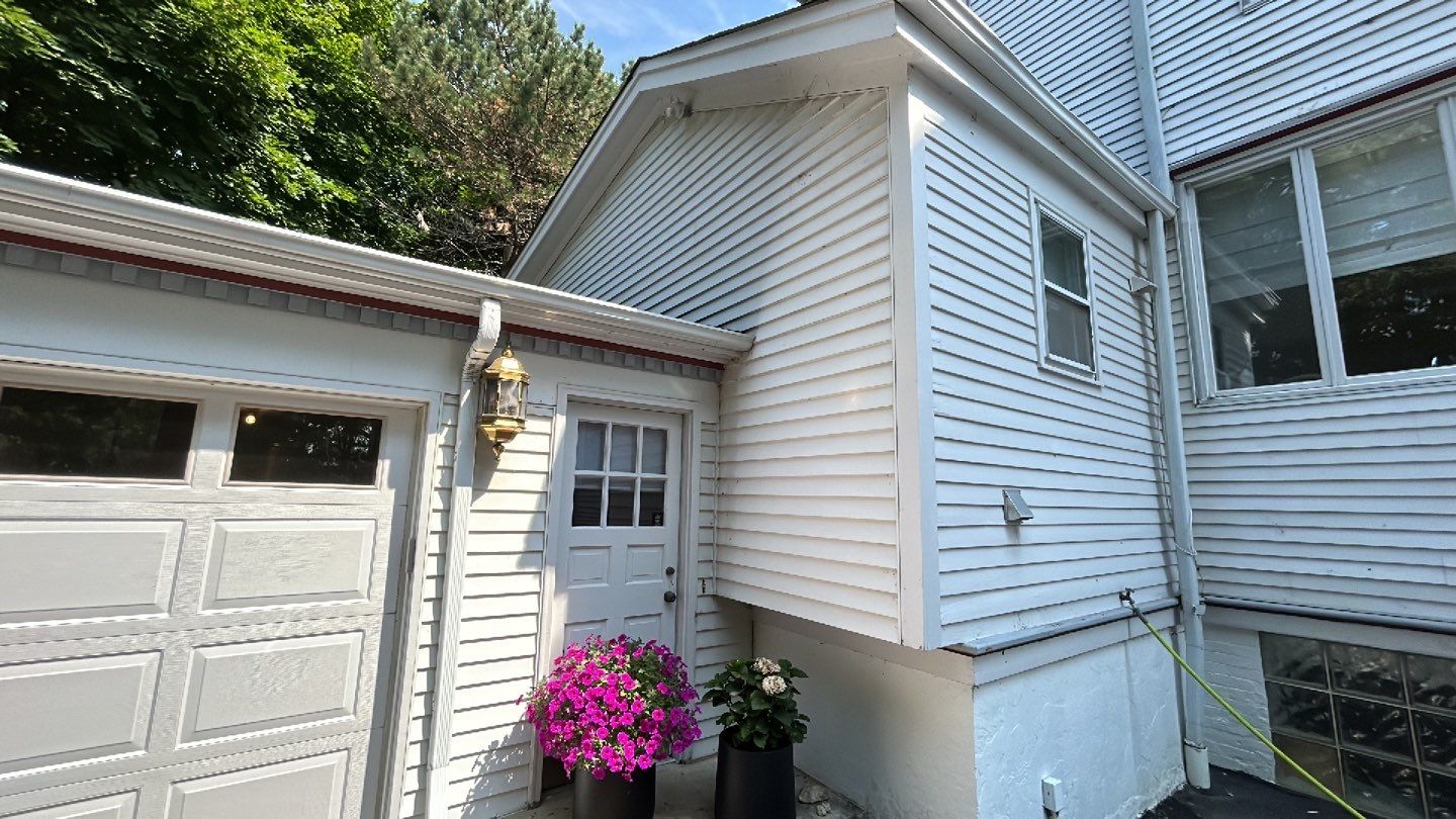 Housewashing  using Algaecide, soft wash soap by Northern Power Washing LLC.