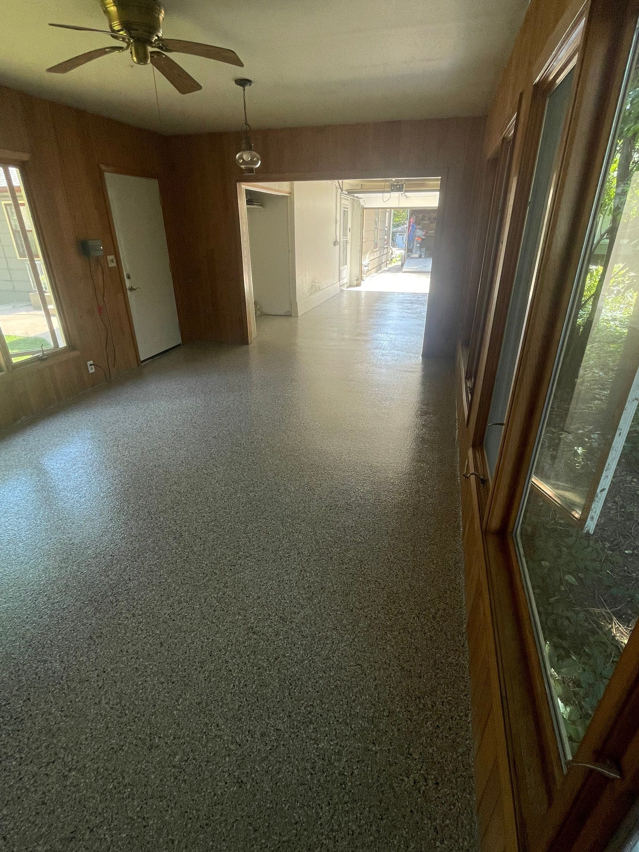 Sioux Falls Garage and Sunroom Concrete Coating with Coyote Flake by Select Painting, Coatings & Garage Cabinets
