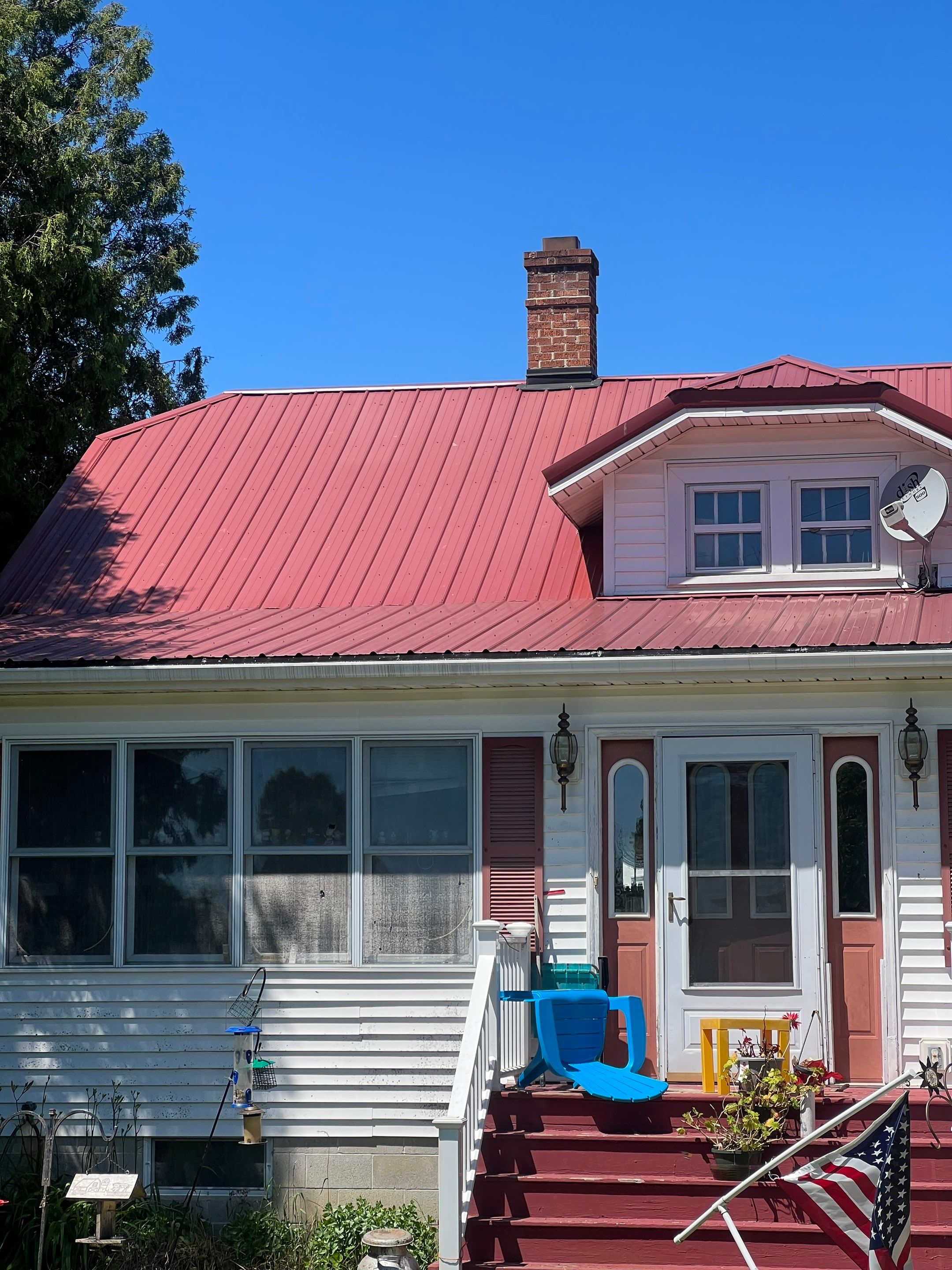 Residential Roof Installation with Red Pro Rib Metal Roofing in Adell, WI by Gellings Roofing and Siding LLC