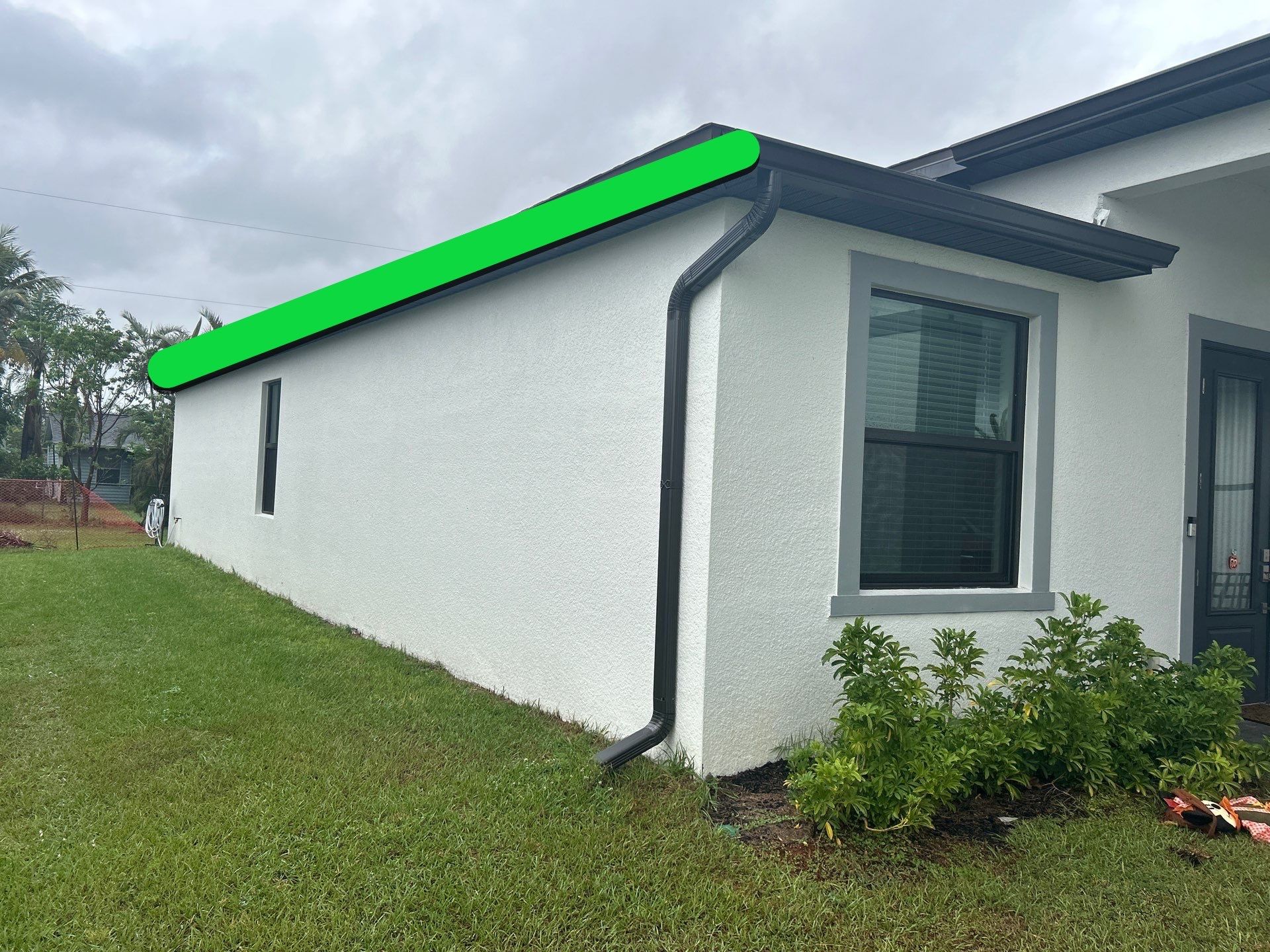 Dark Seamless Gutters and Downspouts in Cape Coral FL by Gutter Professors