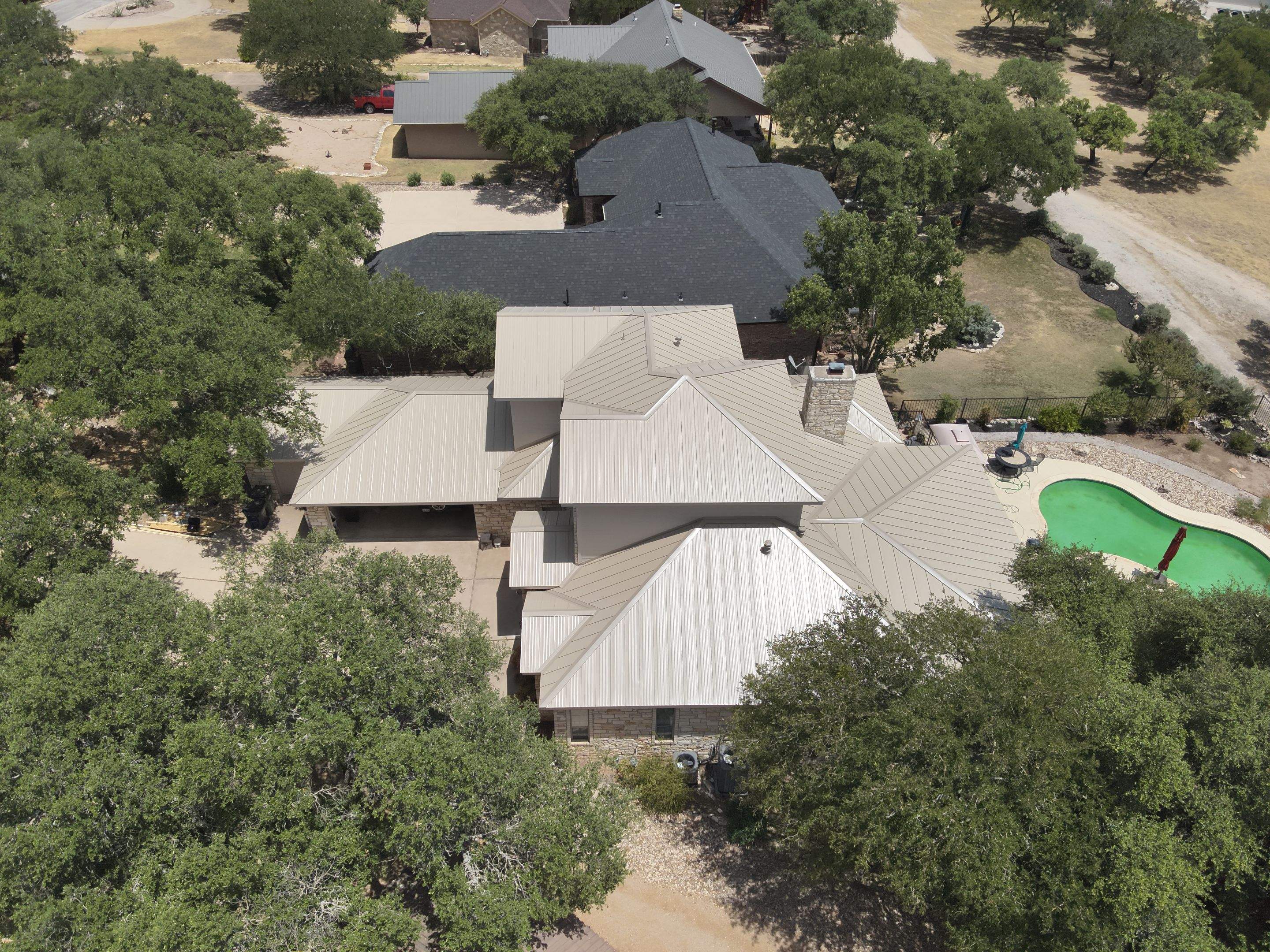 Residential Roof Replacement using 24 GA Double-Lock - Surrey Beige by Action Exteriors Austin